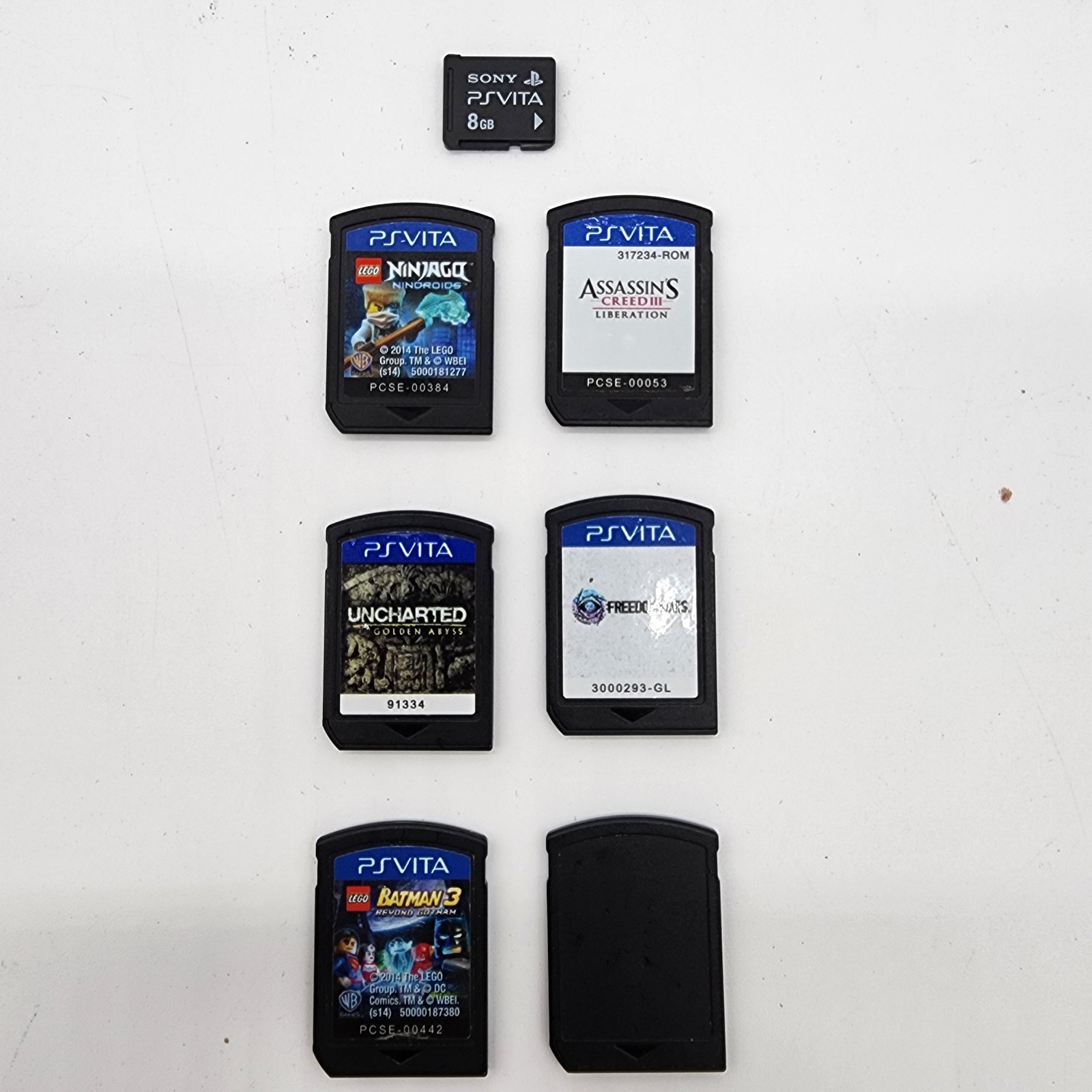 PlayStation PS Vita PCH-1001 Bundle – 5 Games, Memory Card, 8 GB Charger