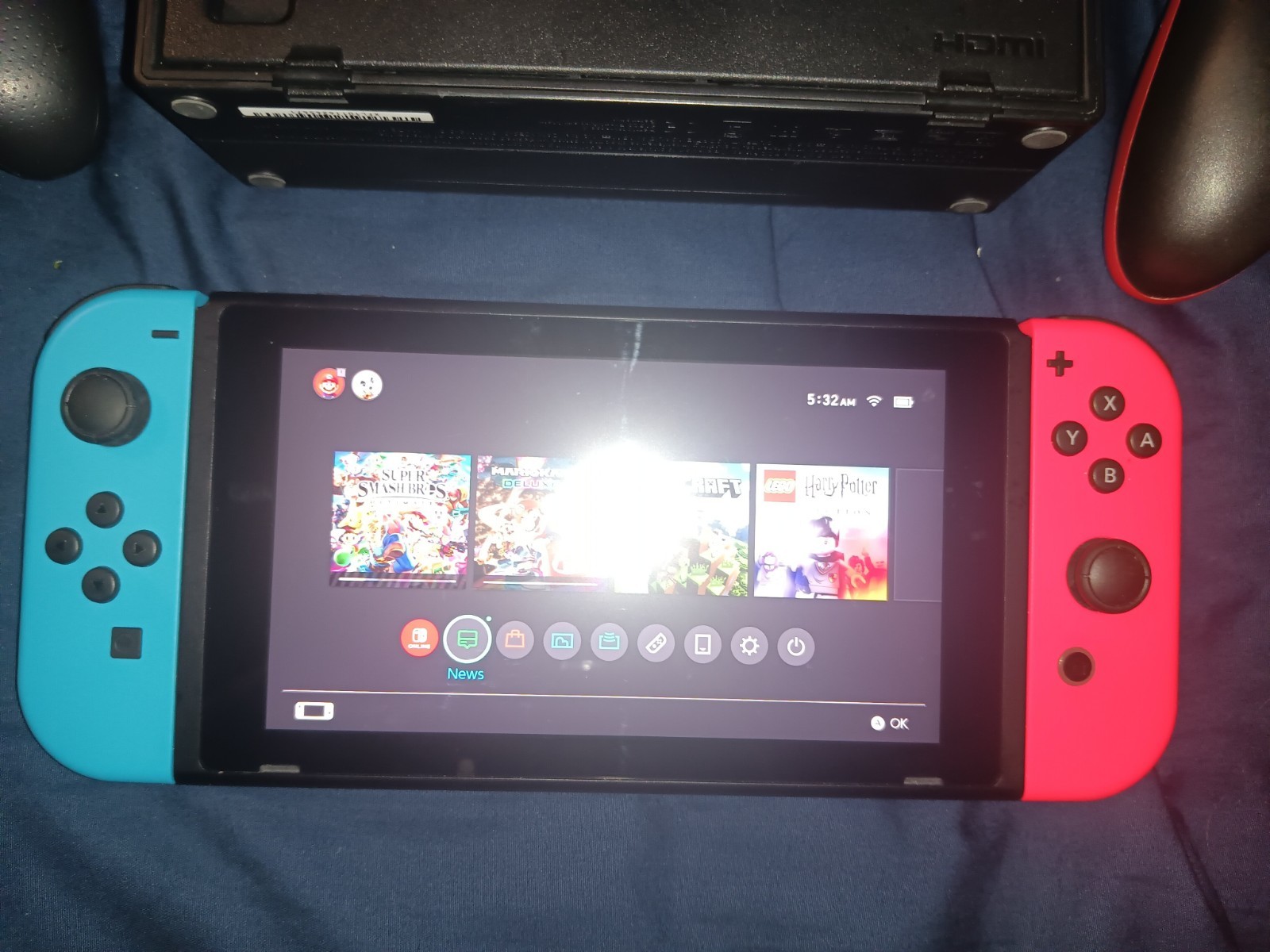 Nintendo Switch console with dock and two controllers
