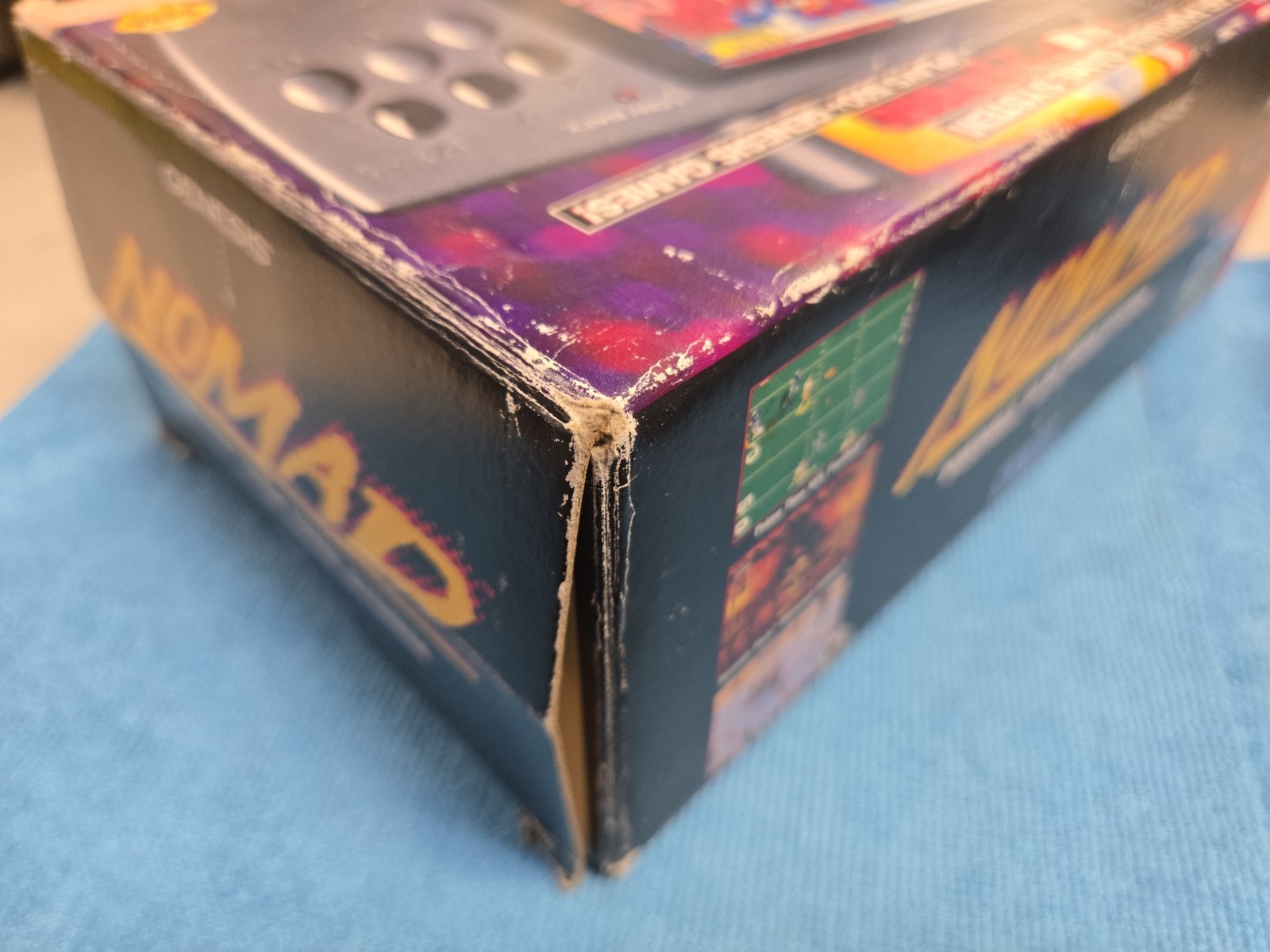 Sega Nomad Console. With Box (no inserts). A/C adaptor. Battery holder missing..