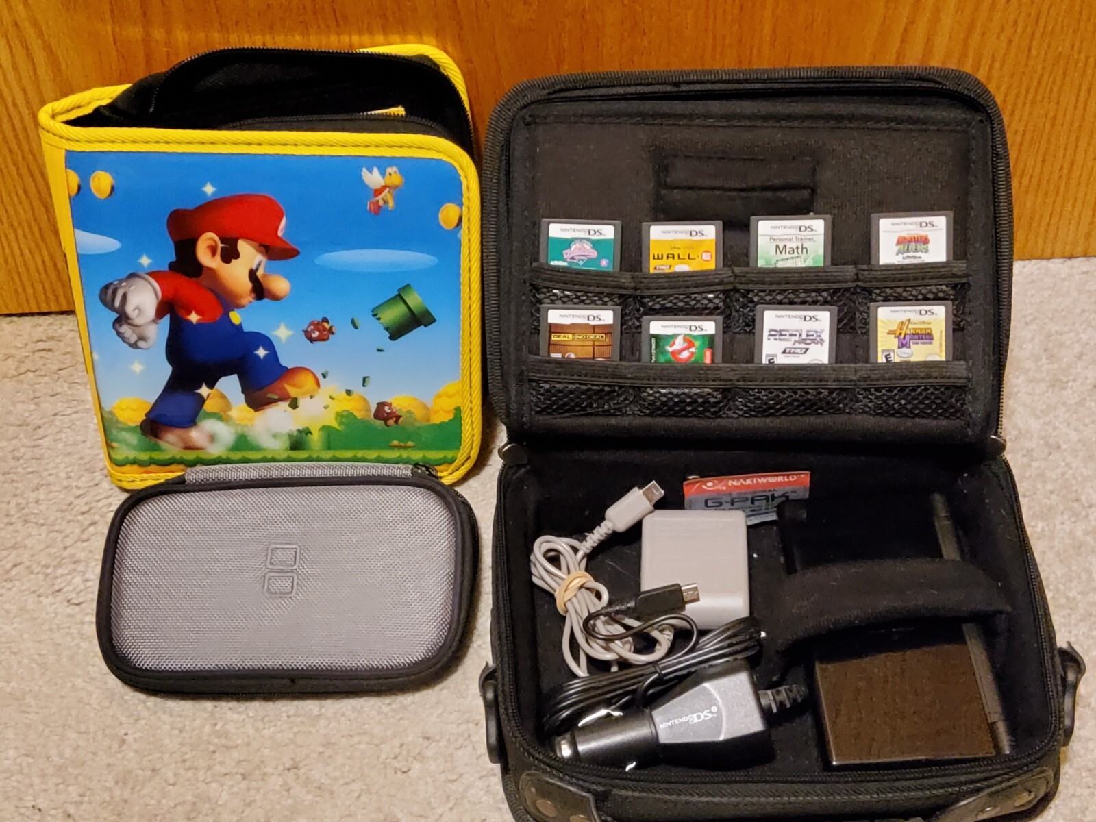 Nintendo DS Lite Black Bundle w/ Charger, Mario, G-Pak, Gamer Cases, 8 games