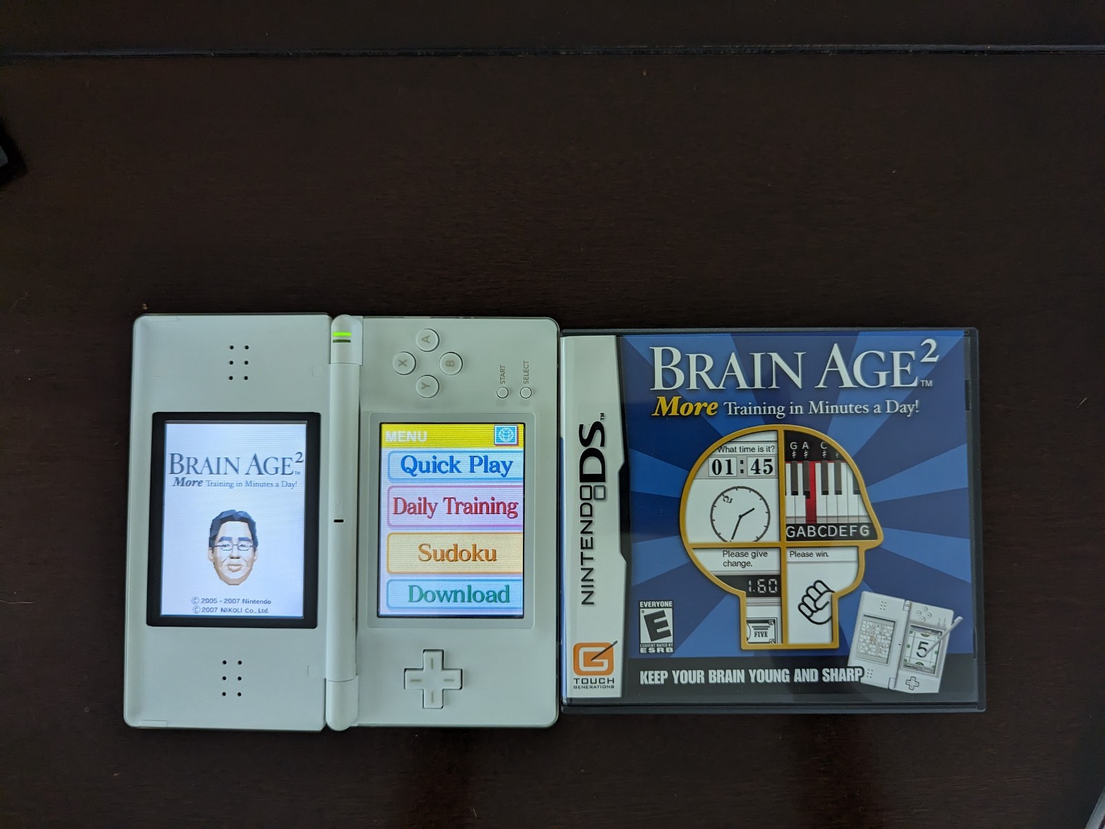 Nintendo DS Lite with Charger, Hard Case, soft case, 15 games in cases.
