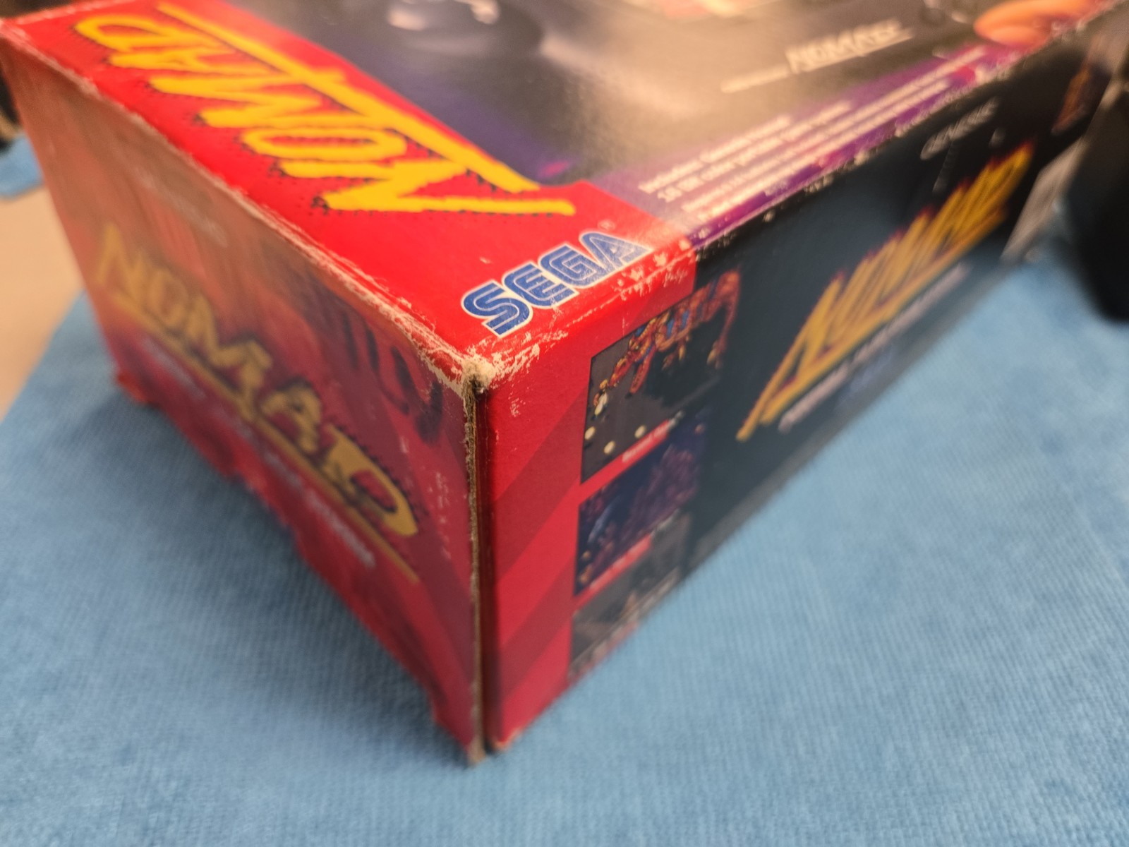 Sega Nomad Console. With Box (no inserts). A/C adaptor. Battery holder missing..