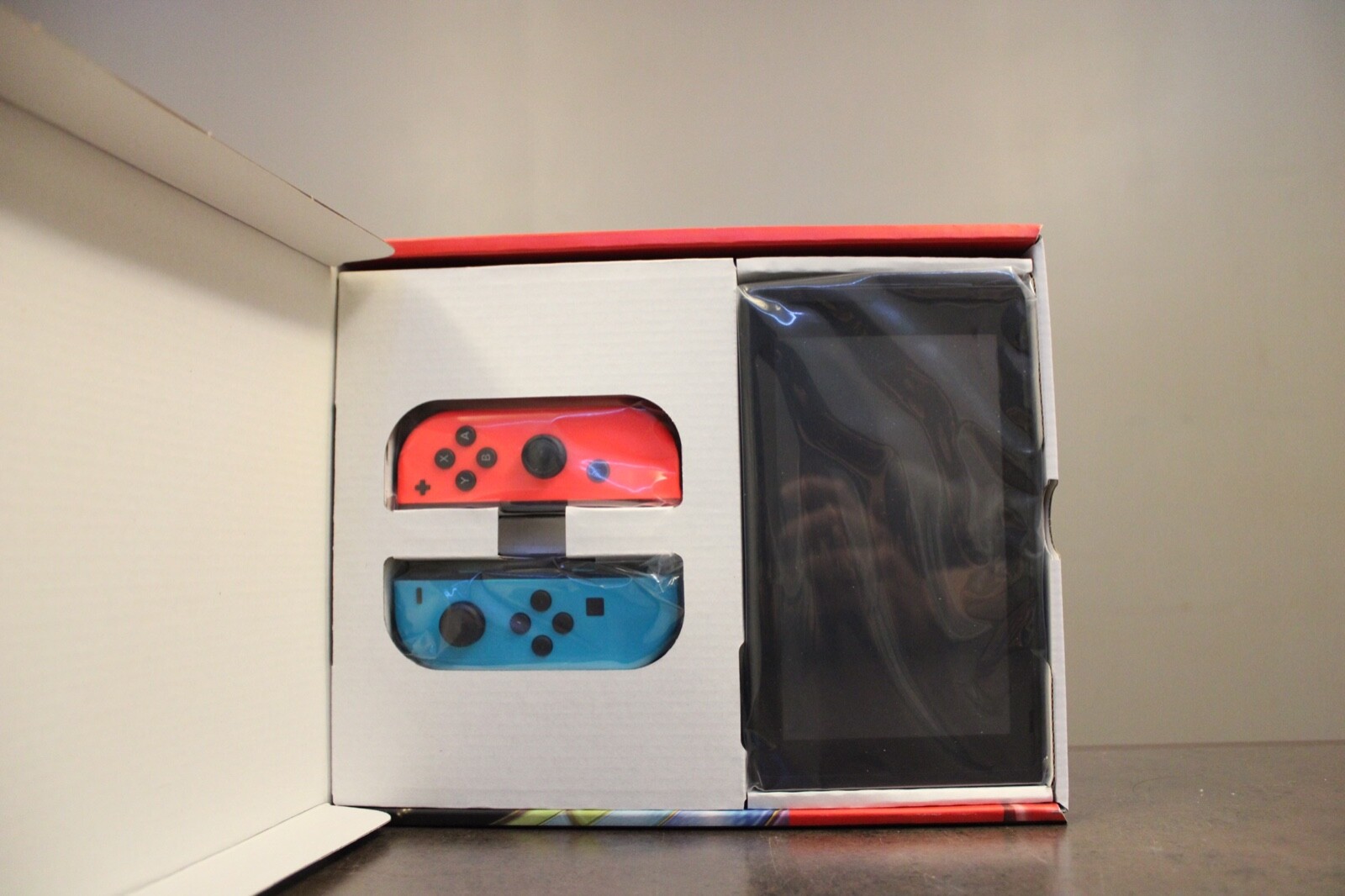 Nintendo Switch with Blue and Red Joy-Con Controllers and Mario Kart 8 Bundle 