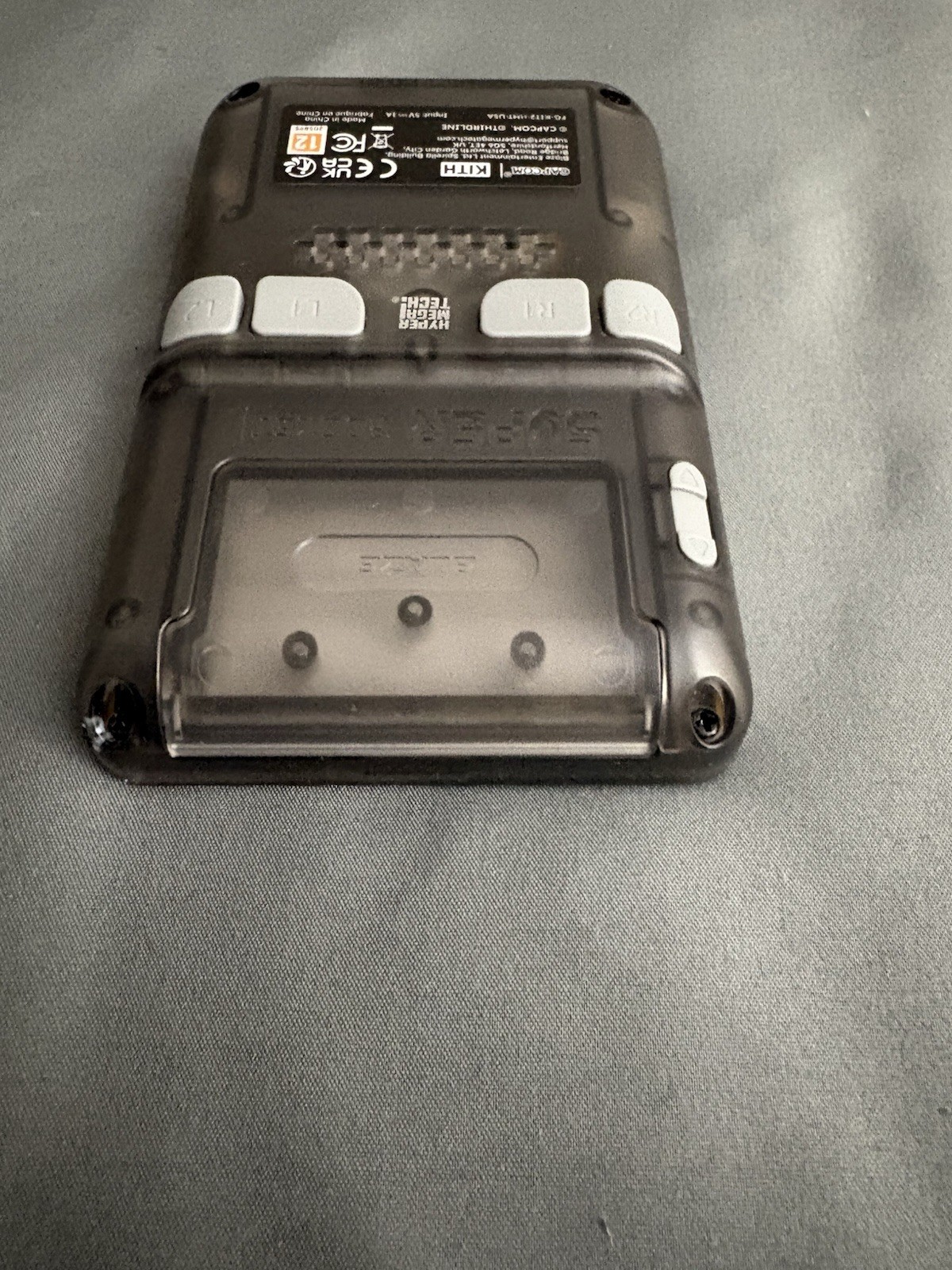 CAPCOM x KITH FOR HYPER MEGA TECH SUPER POCKET HANDHELD CLEAR CONSOLE