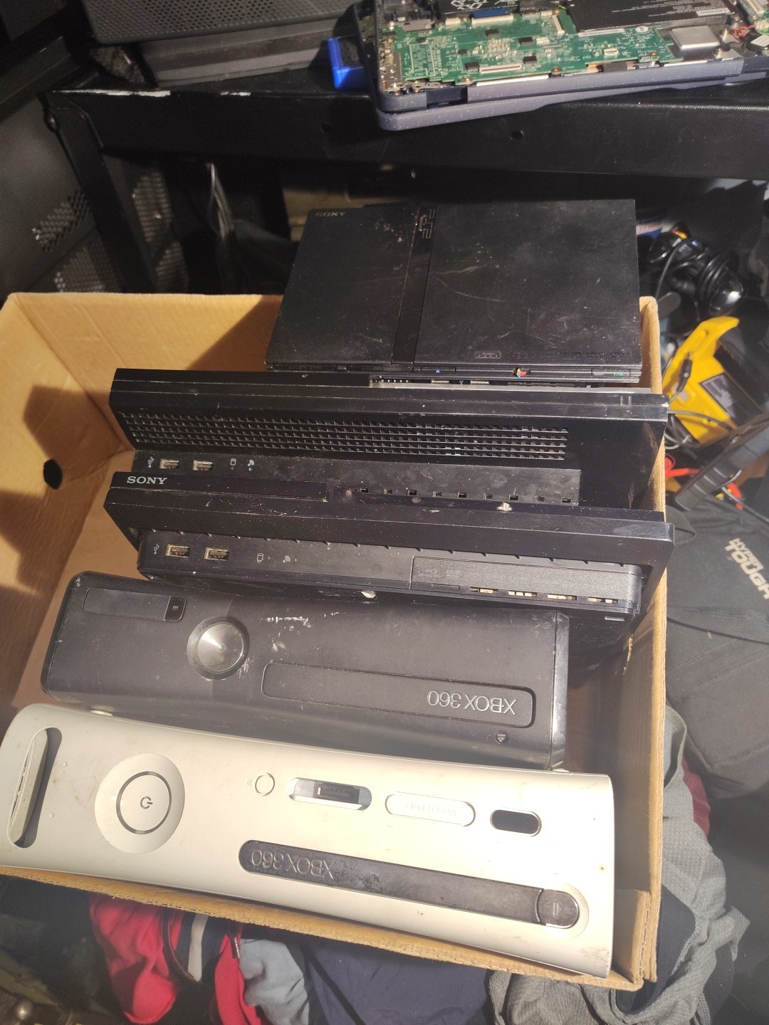 A PS2 To PS3s One Appears To Be A Pro . Two Xbox 360s Later Model & Early Model