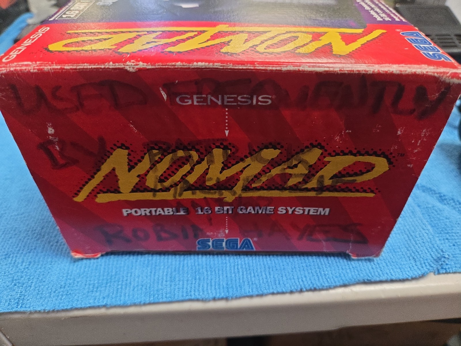 Sega Nomad Console. With Box (no inserts). A/C adaptor. Battery holder missing..