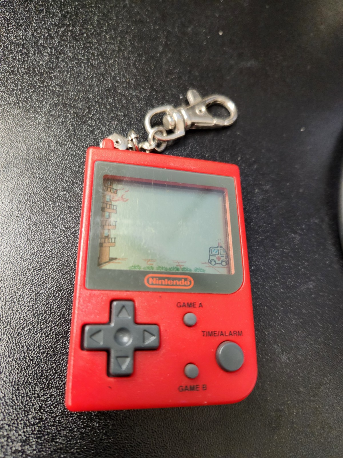 RARE 1998 Nintendo Mini Classic – Red Fire Keychain Game (Stadlbauer)