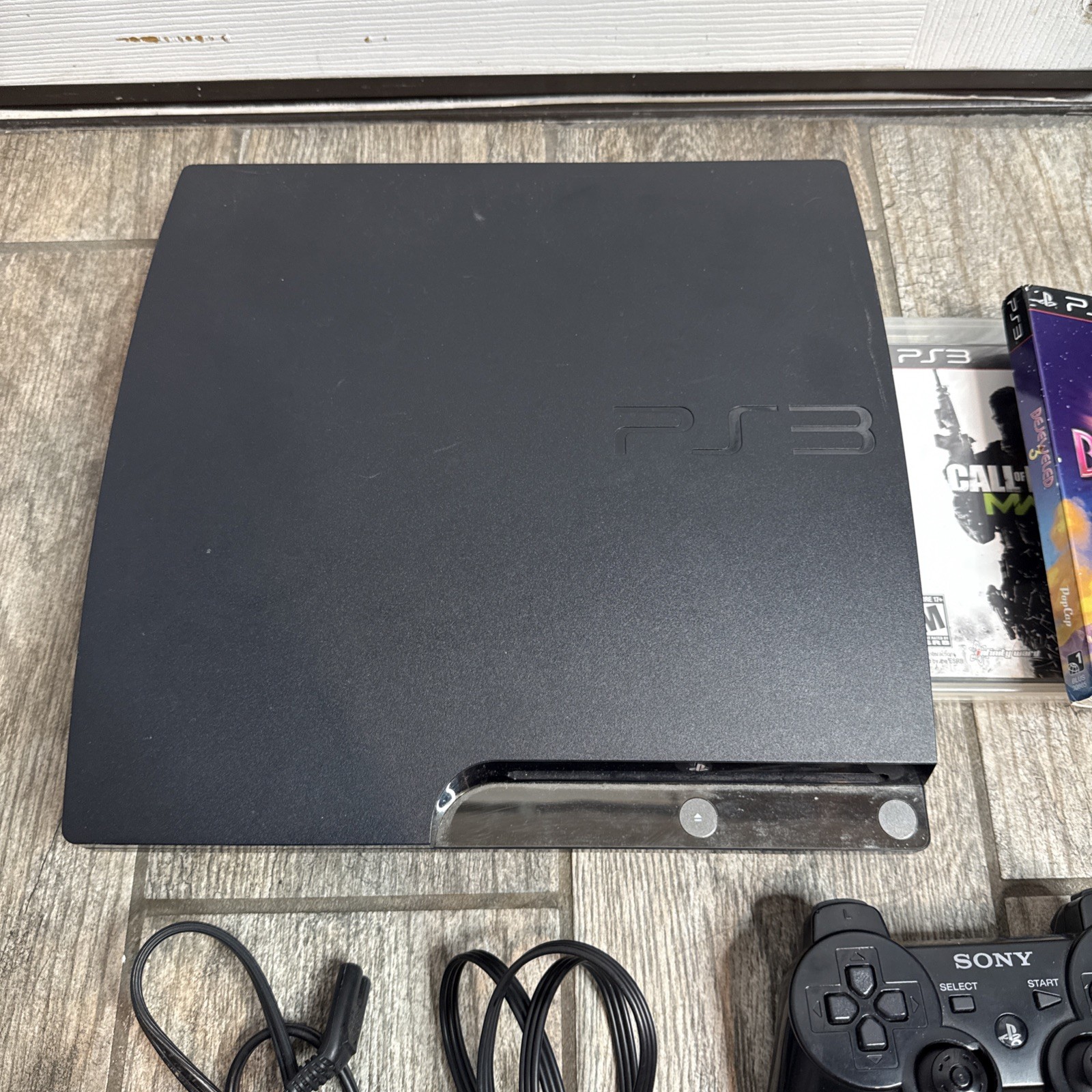 Sony PlayStation 3 Slim 160GB Console CECH-2501A 7 games included