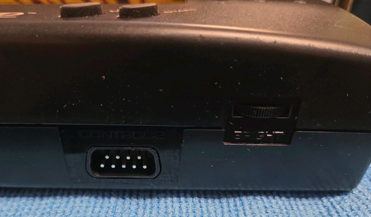 Sega Nomad Console. With Box (no inserts). A/C adaptor. Battery holder missing..