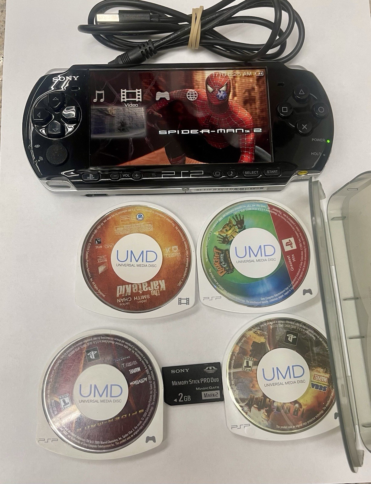 Sony PSP 3001 Portable Handheld Console System memory stick and 5 UMD Cleaned