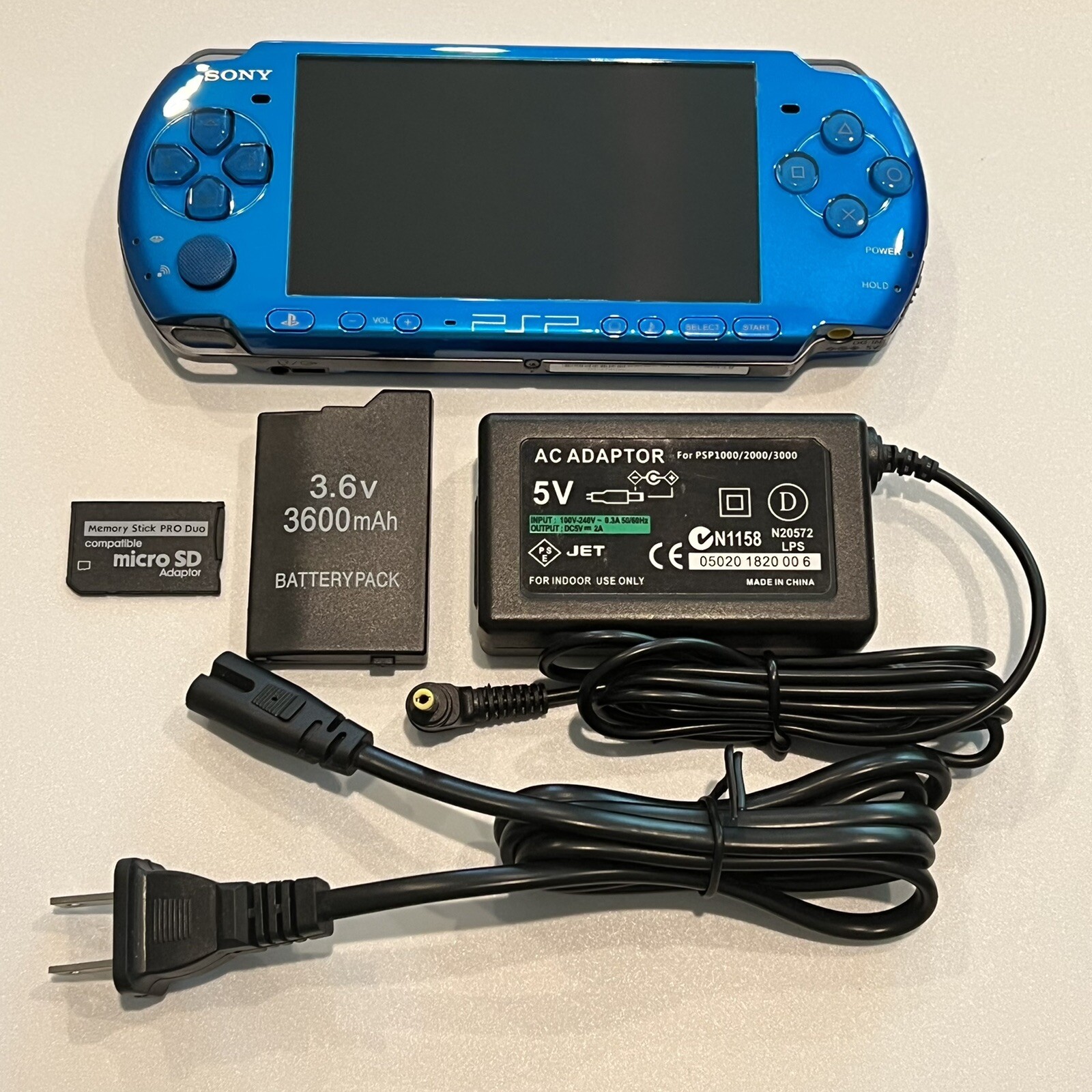 VIBRANT BLUE PSP 3000 System w/ Charger, Battery, 64gb Memory Card Bundle Import