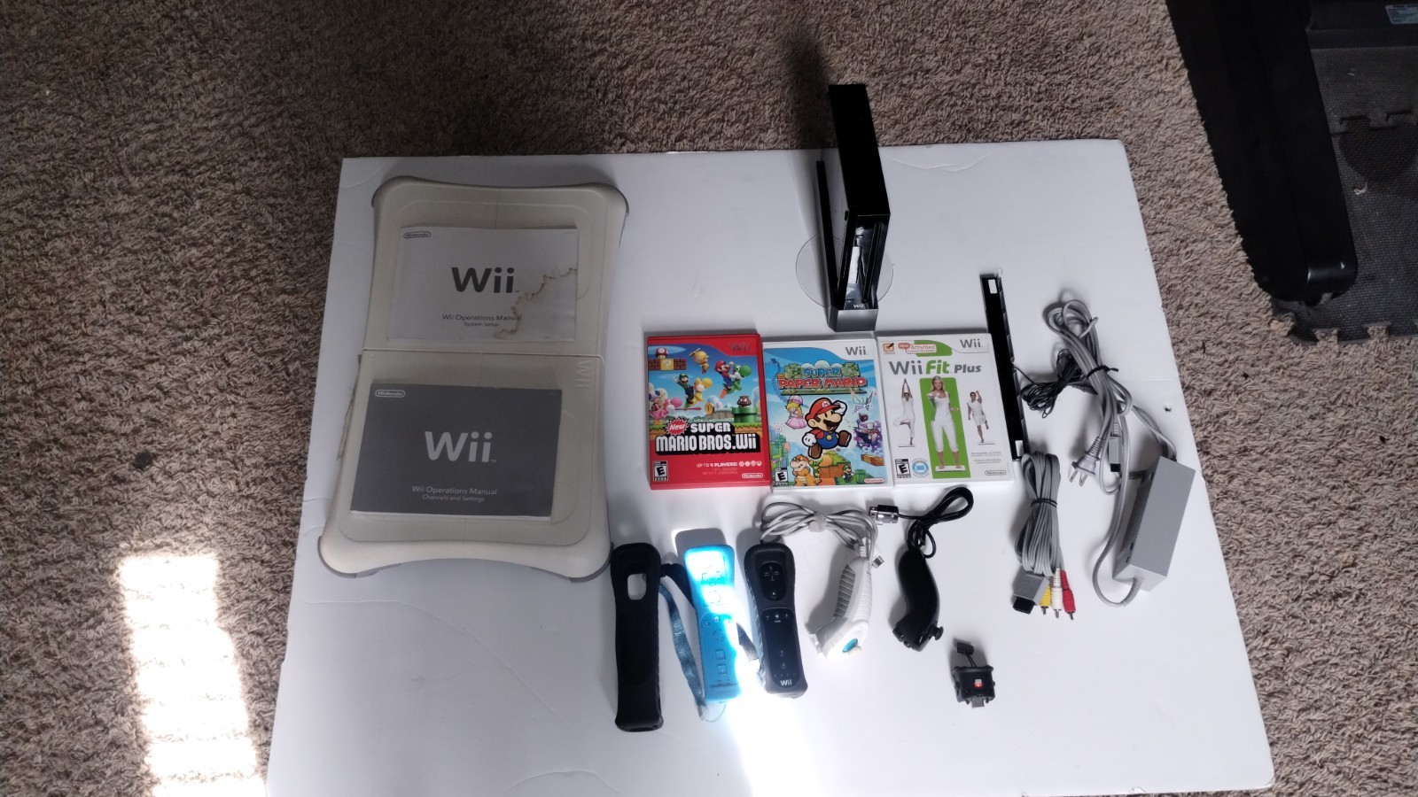 Nintendo Wii Console Bundle with Two Remotes & 3 Games And Wii Fit Board