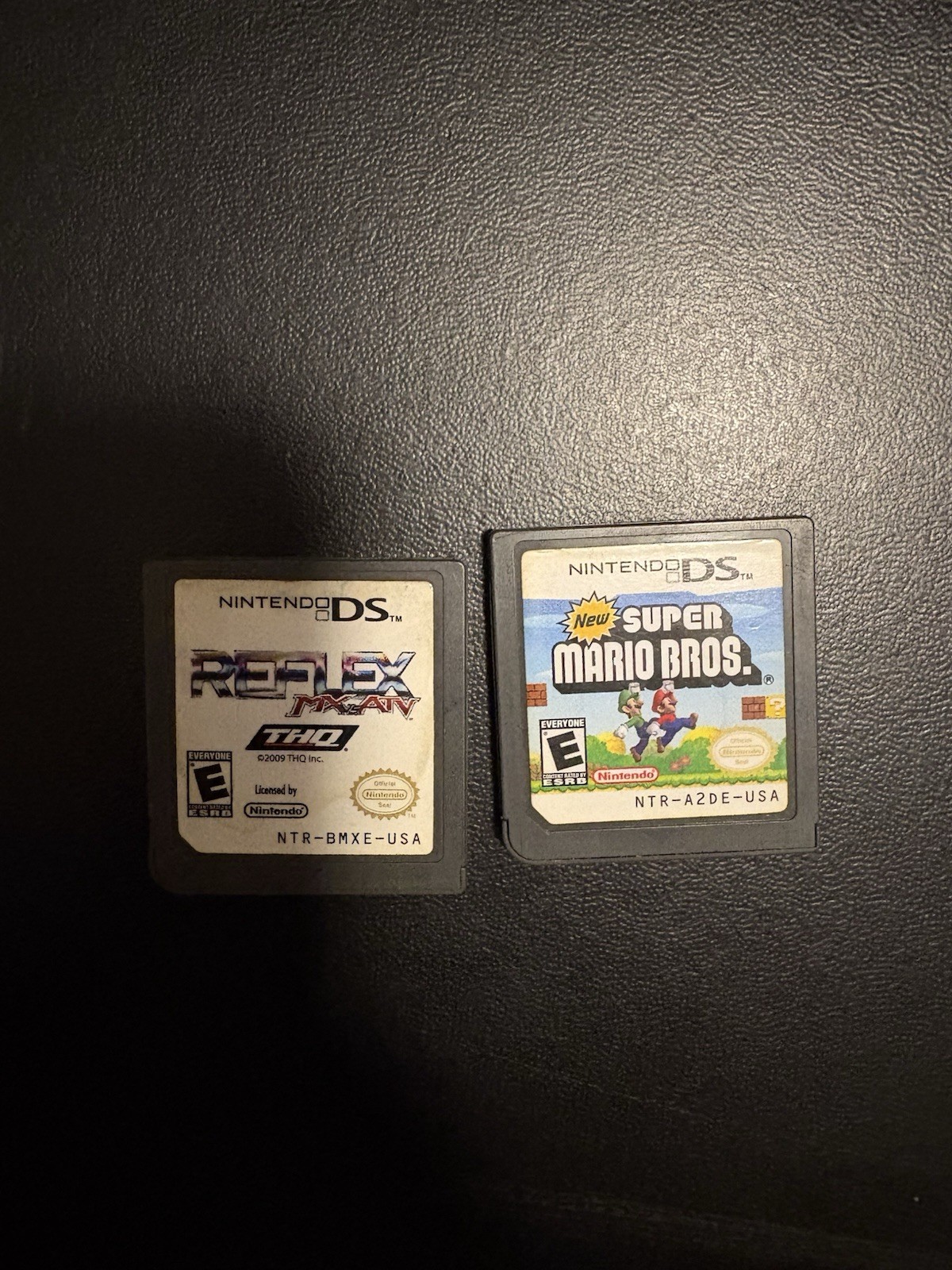 Nintendo DSi XL Midnight w/ USB charger, includes 2 Games, no stylus