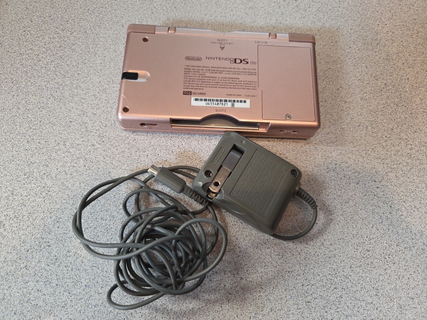 Nintendo DS Lite (Metallic Rose) w/charger, Works but some damage, PLEASE READ!!