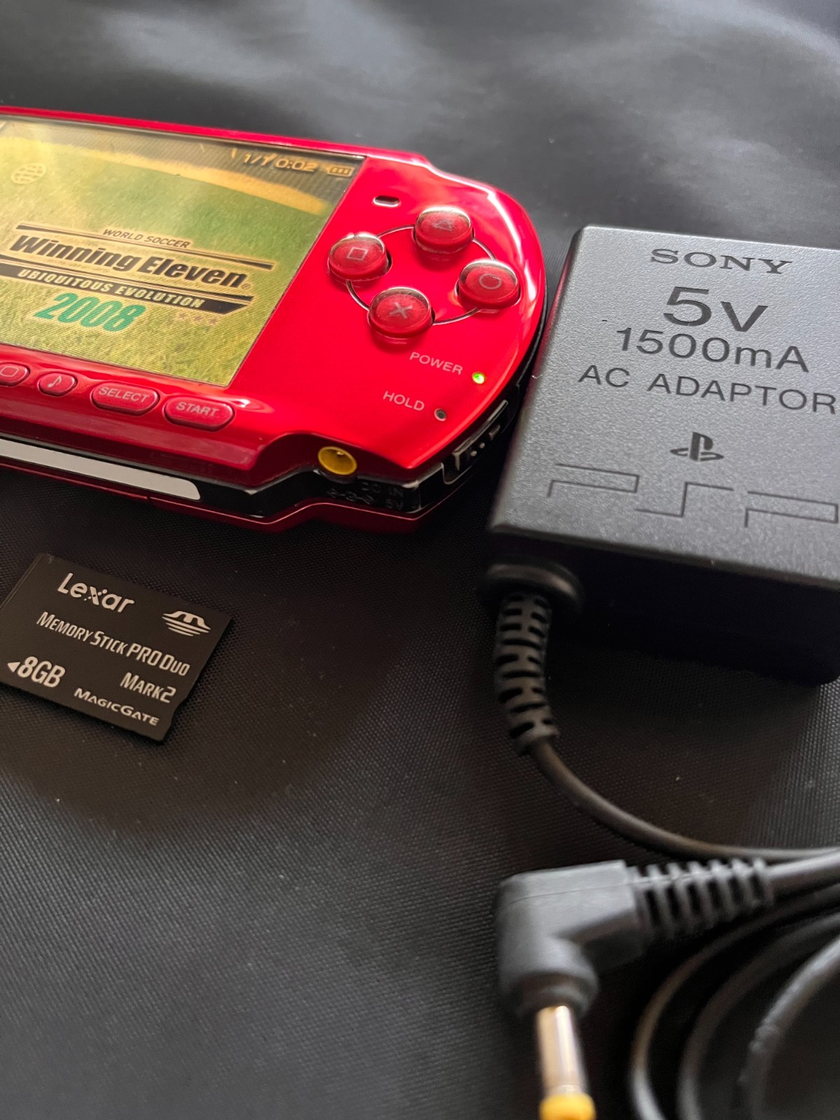 SONY PSP-3000 Radiant Red + AC charger + 8GB Memory – Working, Rank B