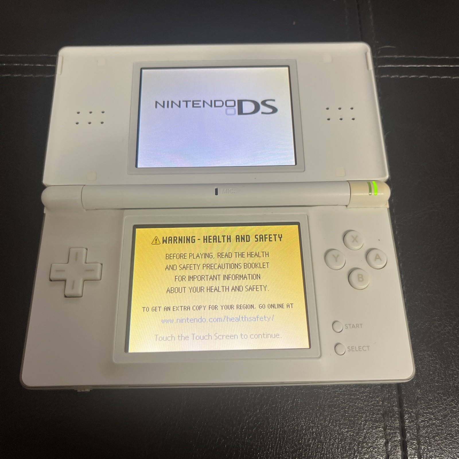 Nintendo DS Lite Handheld System USG-001 White with Charger Stylus Not Included