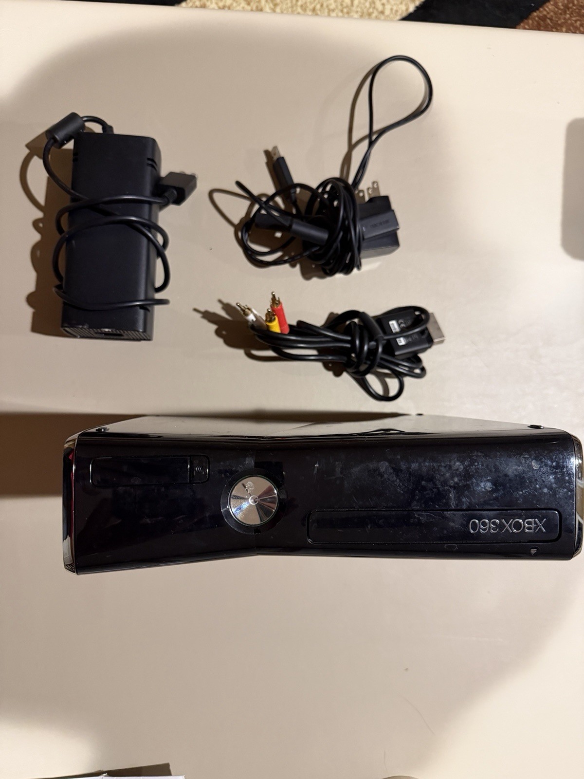 Microsoft Xbox 360 Slim 250GB Black Console, White Controller And Cords(NTSC)