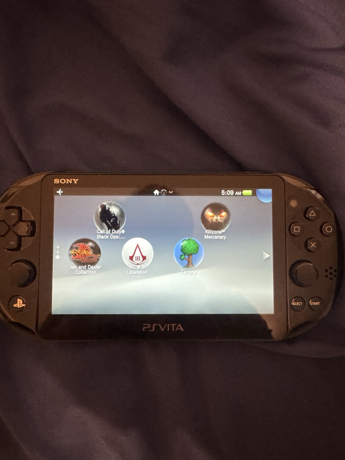 Sony PS Vita Slim (PCH-2001 with 4 Games Case and Charger Included)