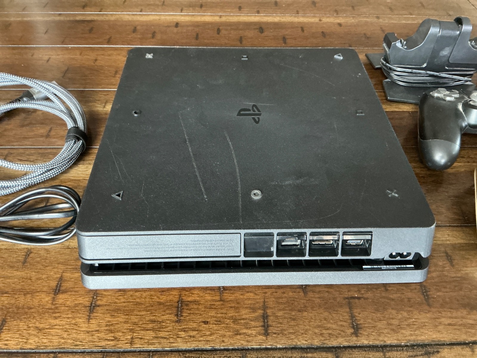 Sony PlayStation 4 Slim Console, two Controllers, Controller Dock and cables