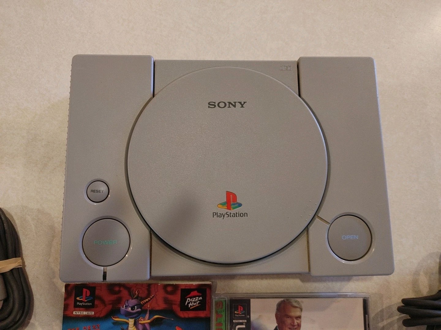 Sony PlayStation Console with two controllers and games