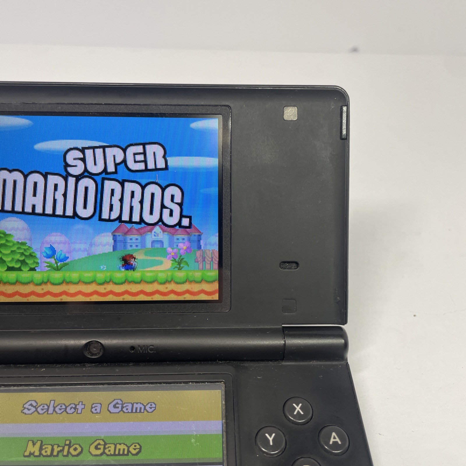Nintendo DSi TWL-001 Black handheld system w/ Mario Bros -needs charger