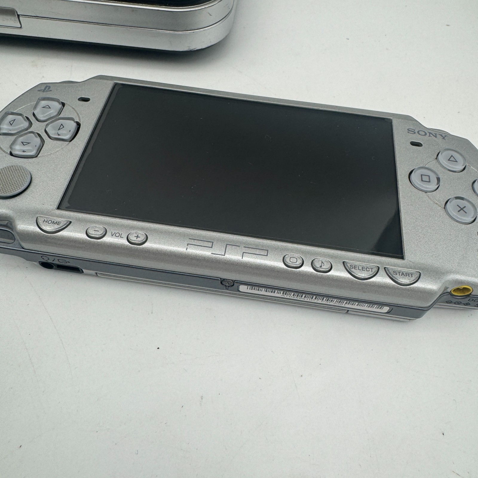 Silver PSP 2001 w/ Battery, Charger, Screen Protector (INCLUDES MEMORY STICK)