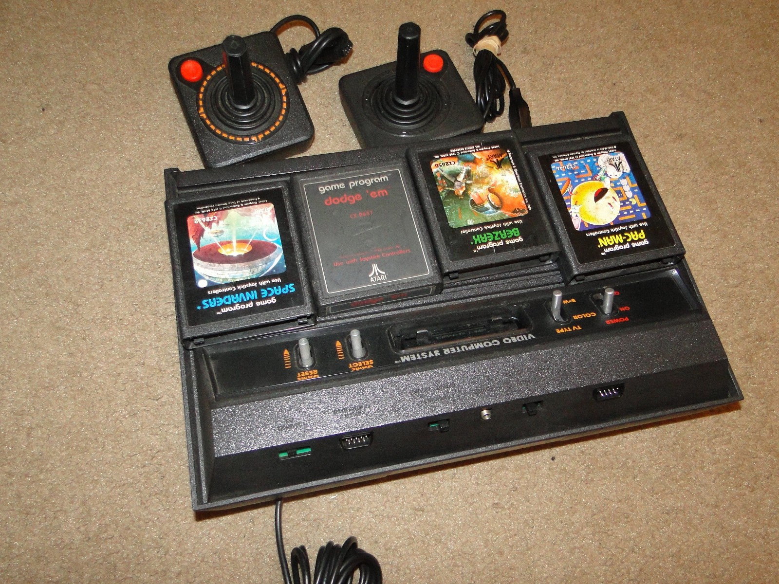 VINTAGE ATARI W/2CONTROLLERS &4 GAMES IT USED TO WORK BEEN YEARS NOT TESTED