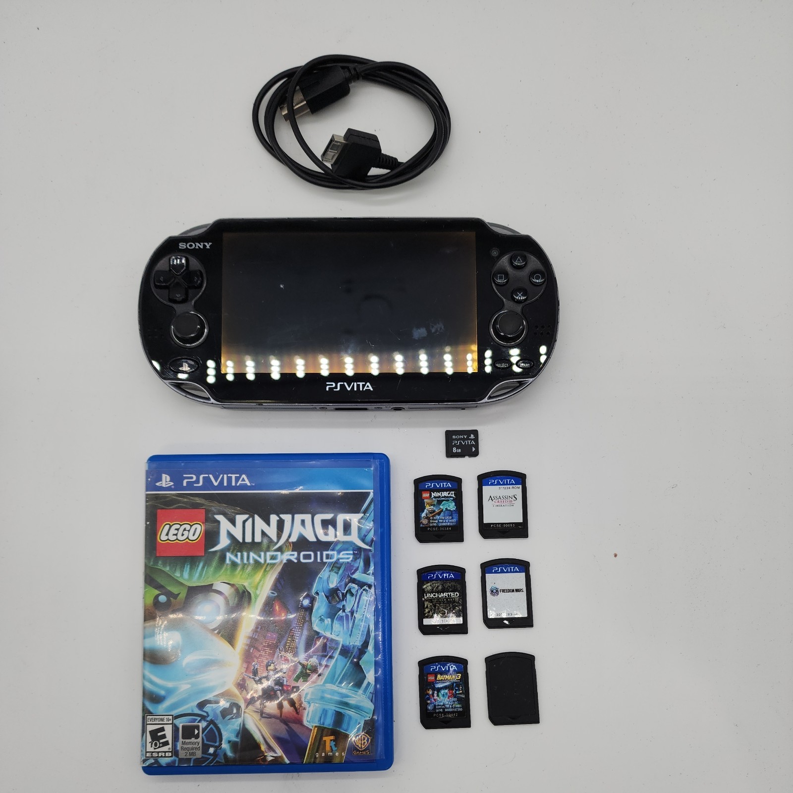 PlayStation PS Vita PCH-1001 Bundle – 5 Games, Memory Card, 8 GB Charger