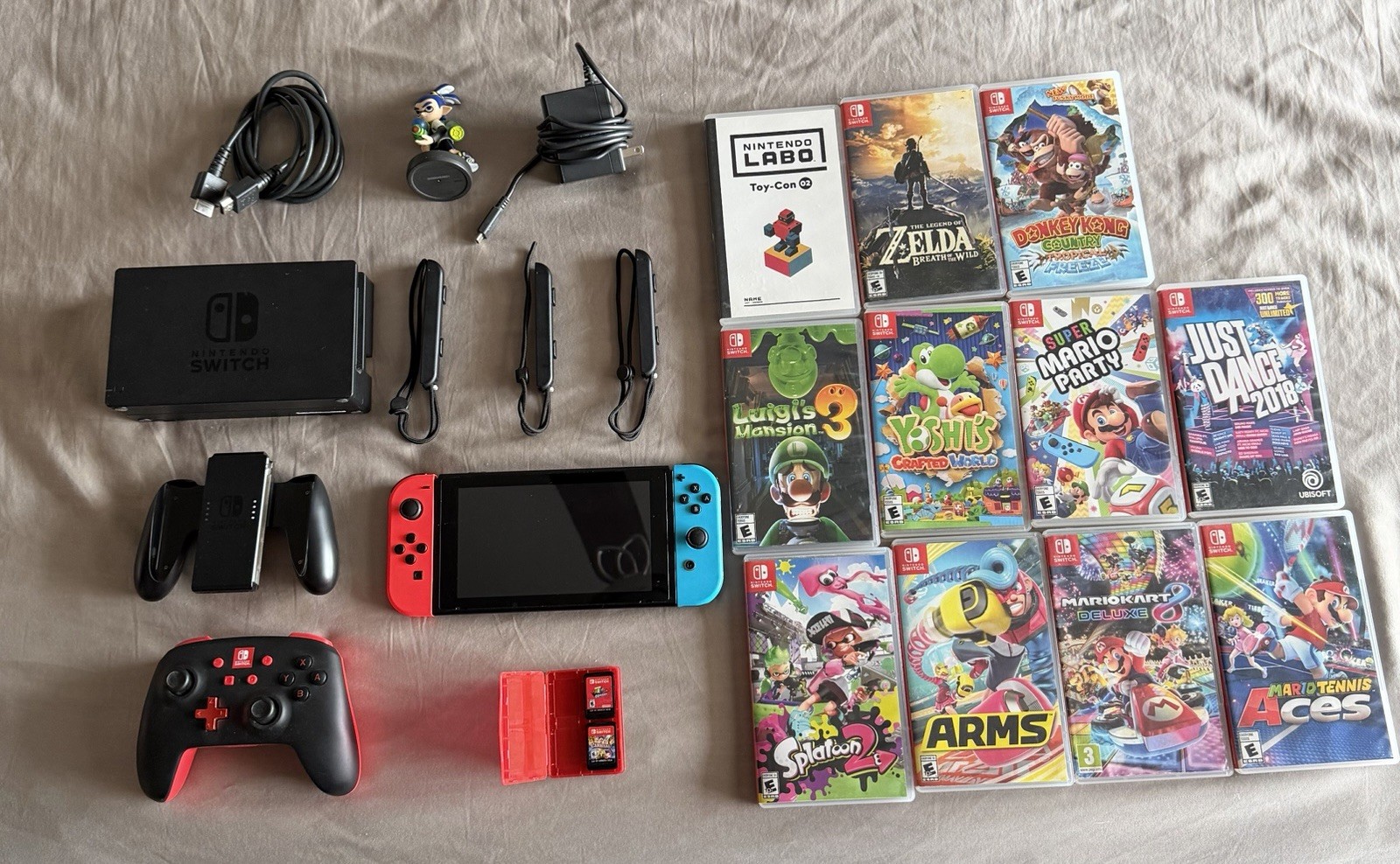 Nintendo Switch w/ 13 games, controllers, amiibo & extras