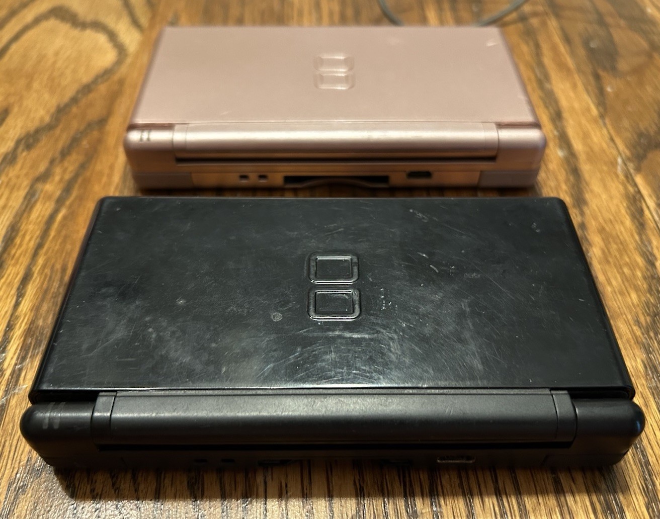 Nintendo DS Lite Metallic Rose Gold Pink Console w/ Charger and Black DS READ