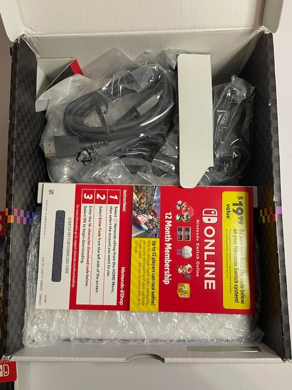 Nintendo Switch OLED – White Joycon With 64gb SD card (no game included)