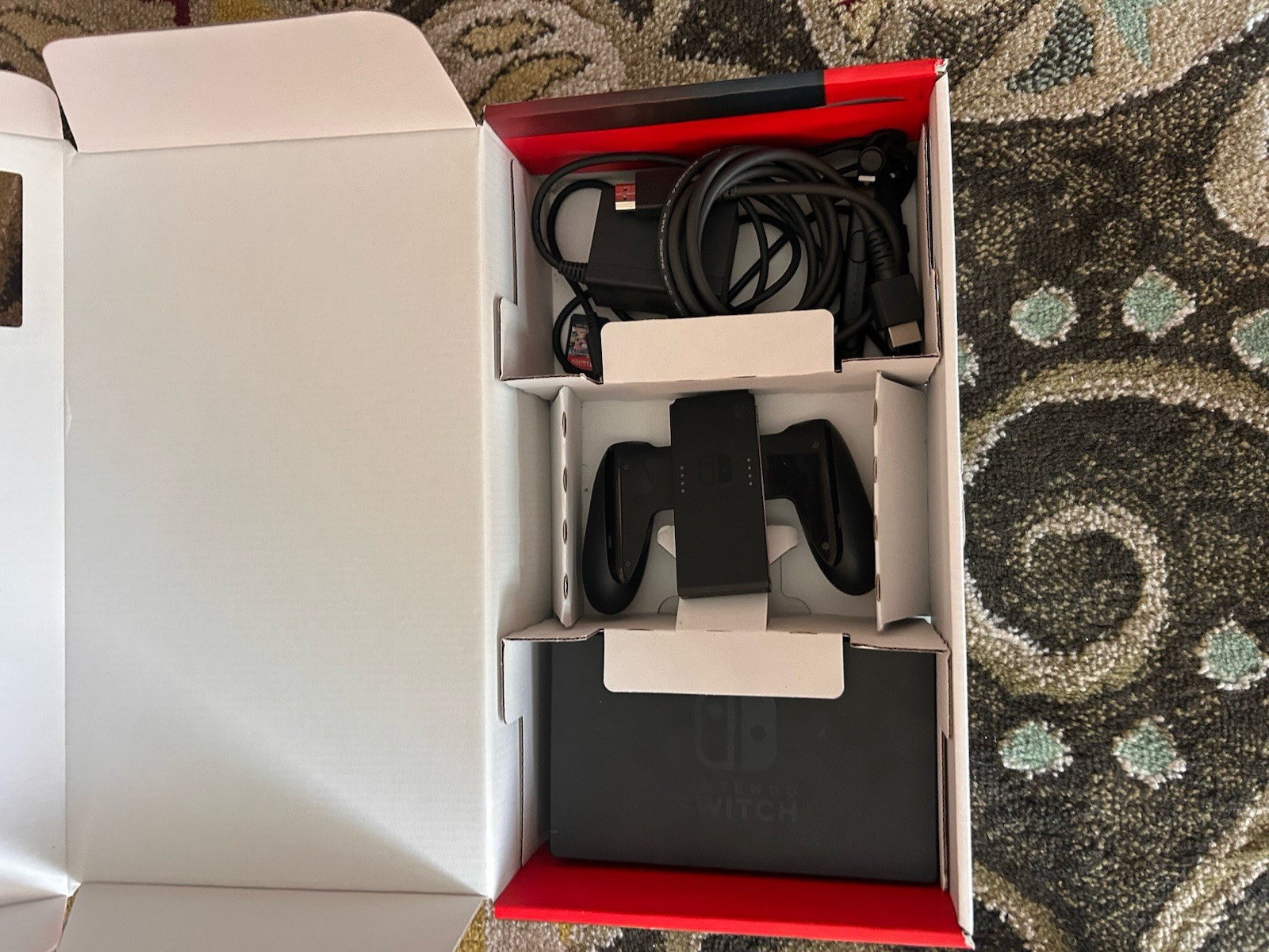 Nintendo Switch with everything still included works perfectly fine.