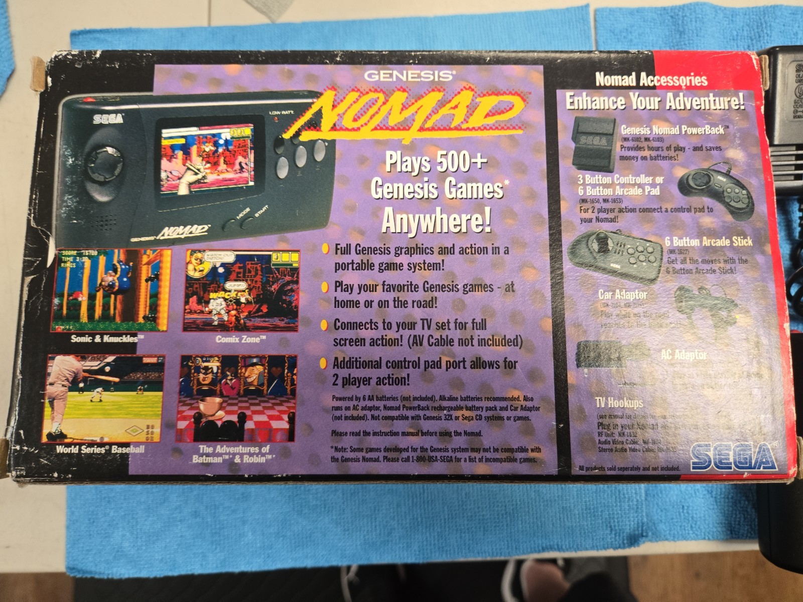 Sega Nomad Console. With Box (no inserts). A/C adaptor. Battery holder missing..