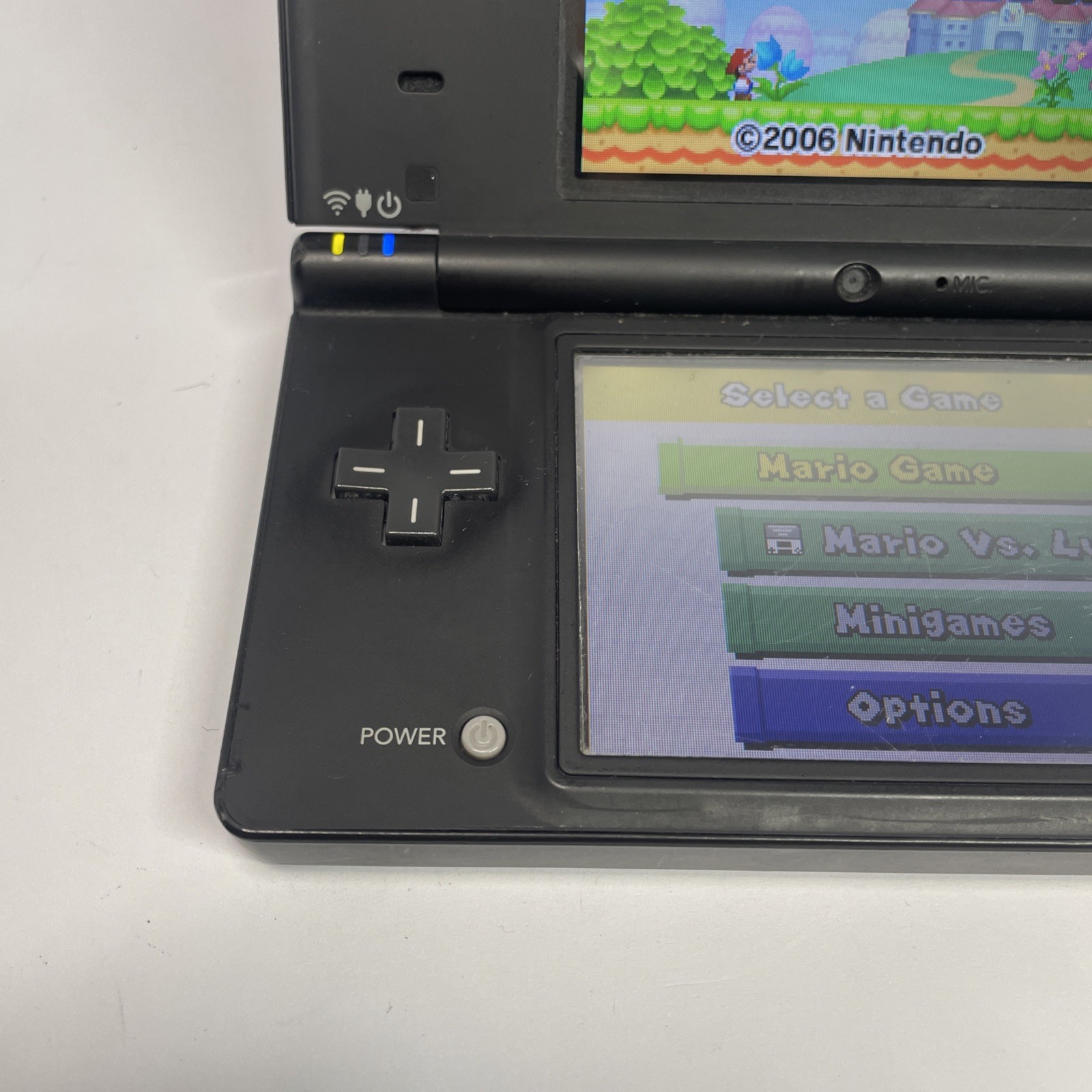 Nintendo DSi TWL-001 Black handheld system w/ Mario Bros -needs charger