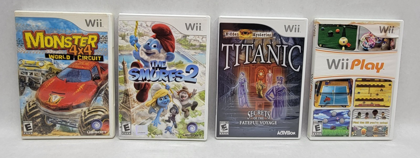 Nintendo Wii Bundle w/ Cords, Controllers & 4 Games (Play, Smurfs, 4×4, Titanic)
