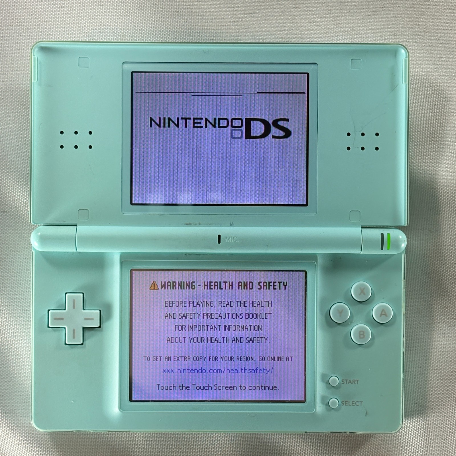 Nintendo DS Lite Ice Blue Handheld System – Doesn’t Read Games