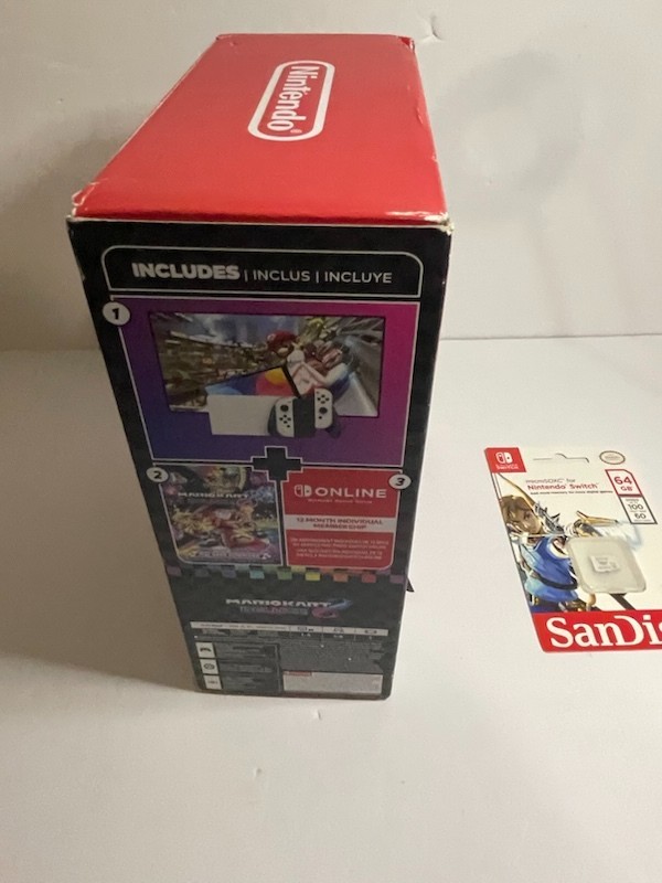 Nintendo Switch OLED – White Joycon With 64gb SD card (no game included)
