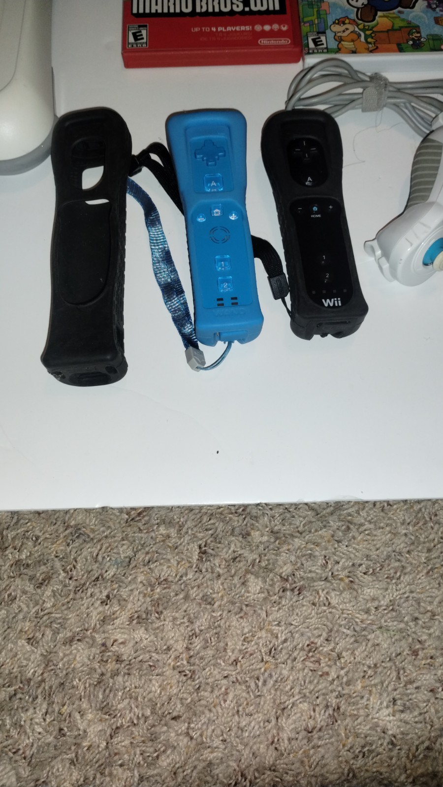Nintendo Wii Console Bundle with Two Remotes & 3 Games And Wii Fit Board