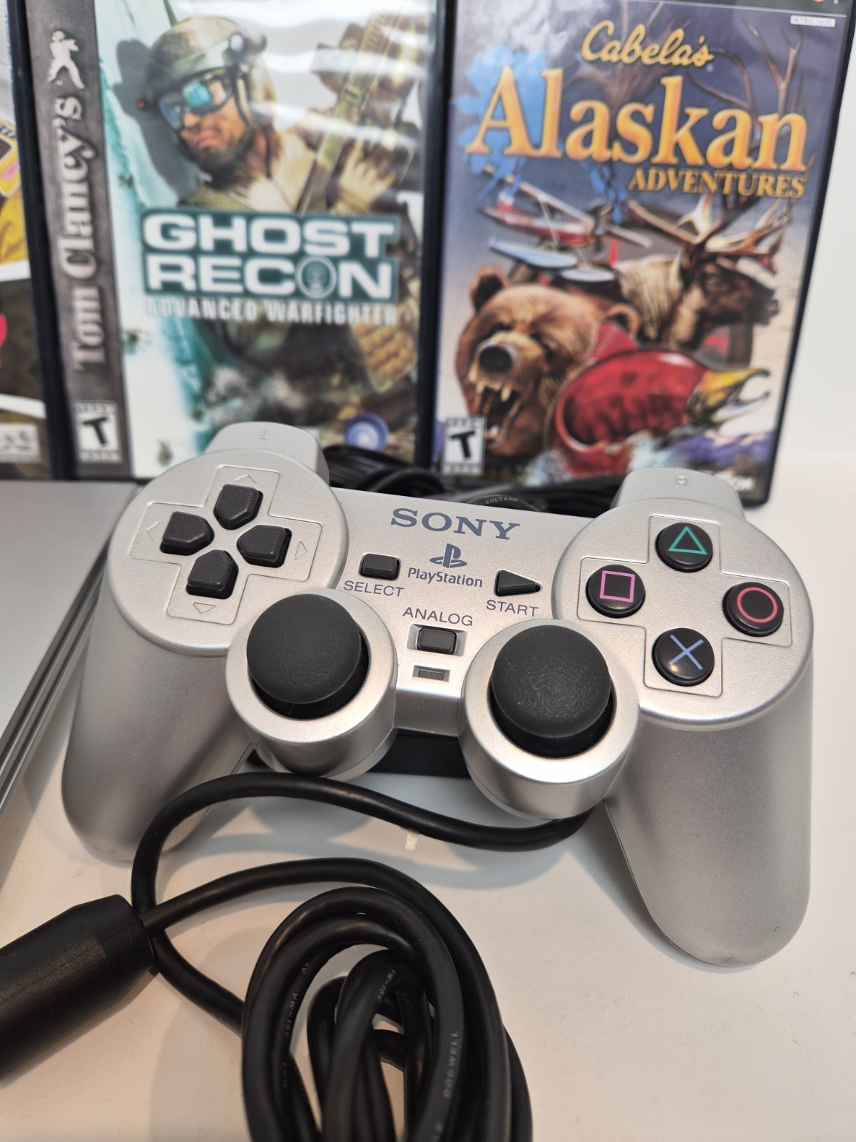 NEW LASER Silver PS2 Slim SCPH-77001 Bundle -NEW BATTERY – Cleaned 4 games Cords