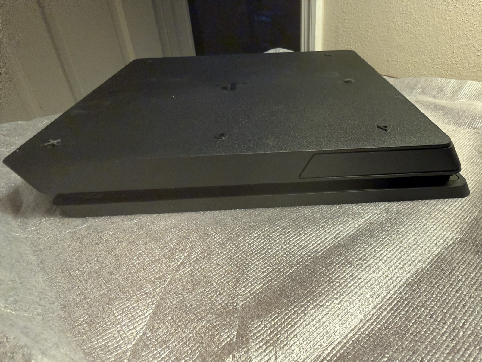 Sony PlayStation 4 Slim Jet Black, 500GB with 2 controllers (1 older model).