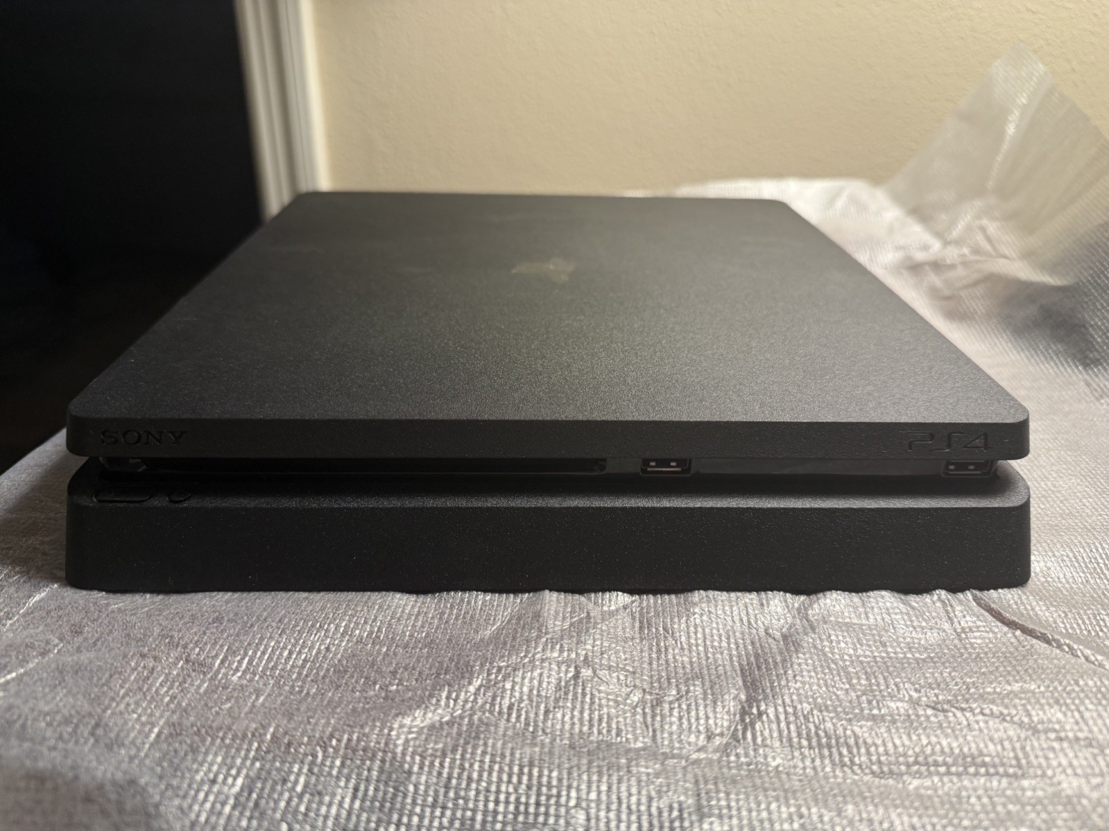 Sony PlayStation 4 Slim Jet Black, 500GB with 2 controllers (1 older model).