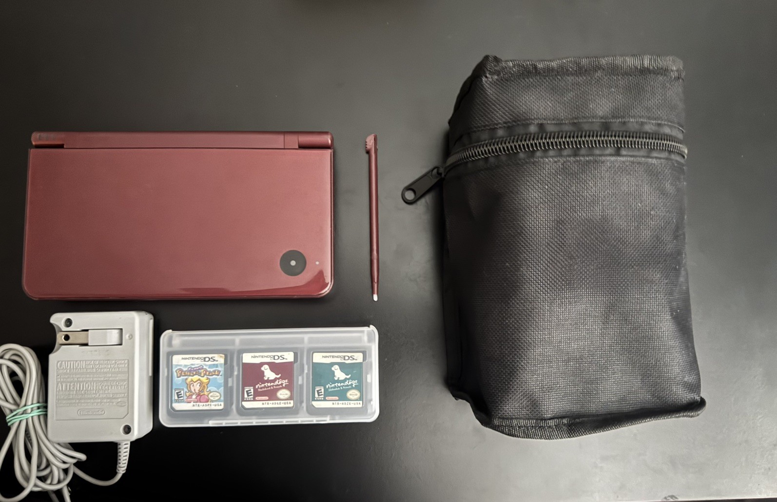 Nintendo DSI XL Burgundy with Charger, Stylus Pen, Pouch, and 7 Games Included!