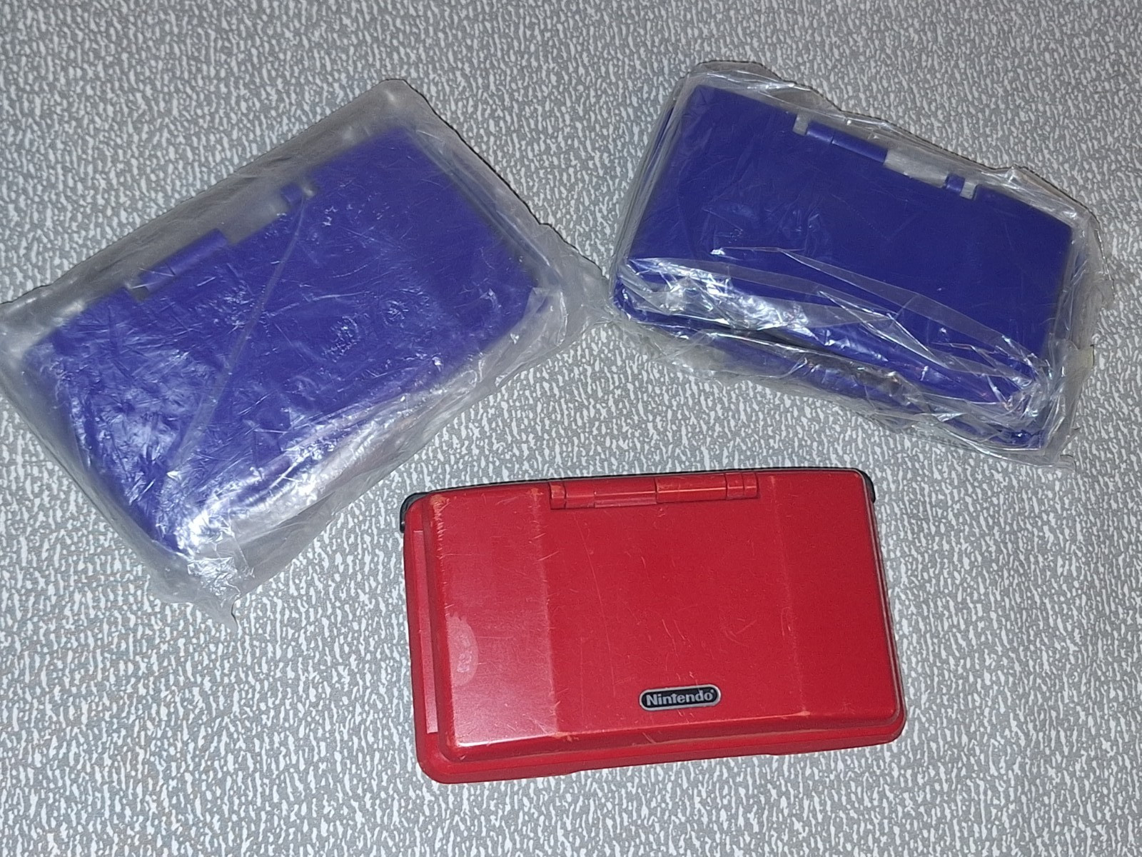 NINTEDO DS LOT W 1 CONSOLE 2 SHELLS 6 EU AC CORDS 1 USB CORD & SCREWDRIVER SETS