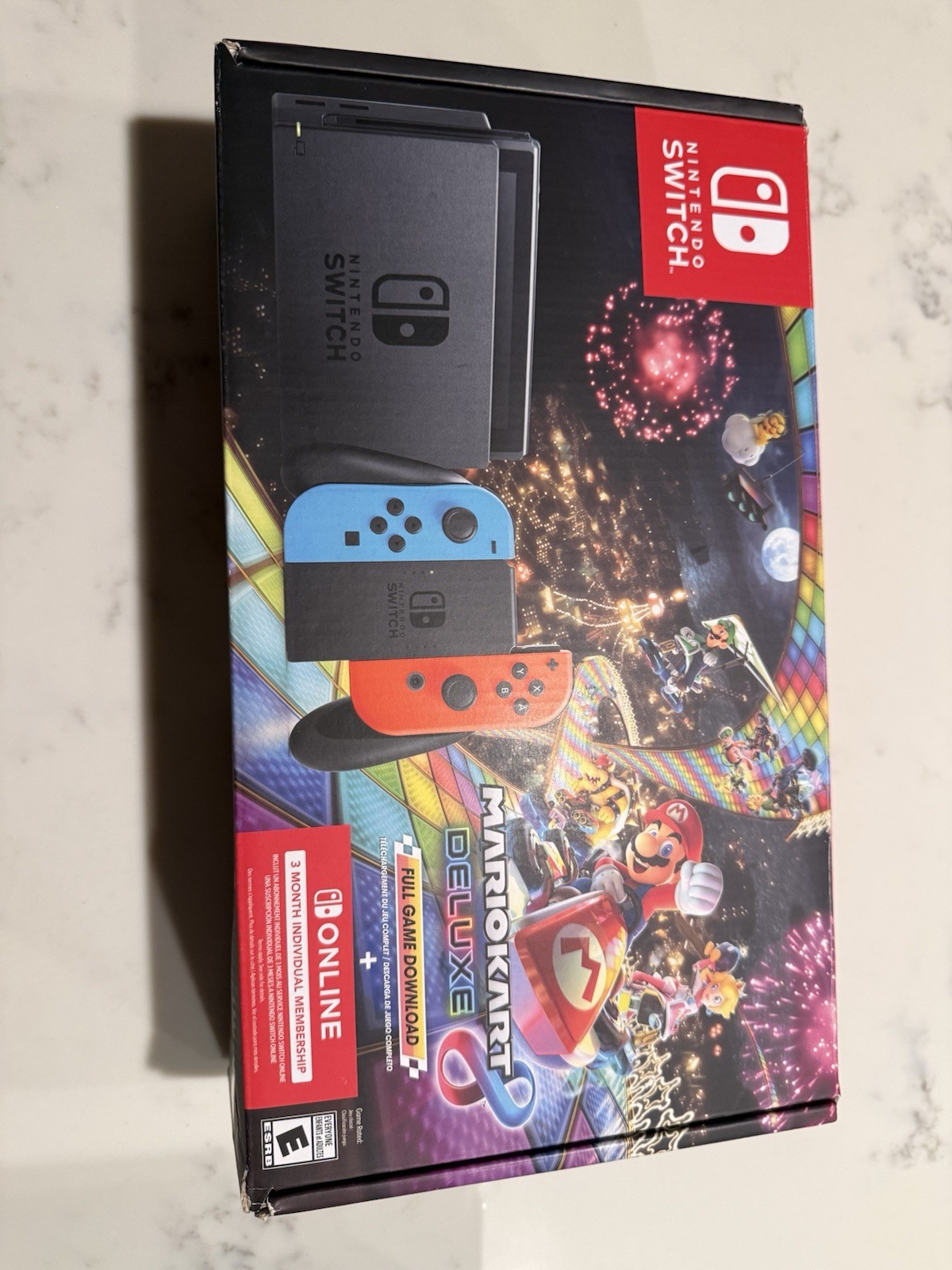 Nintendo Switch with Blue and Red Joy-Con Controllers and Mario Kart 8 Bundle