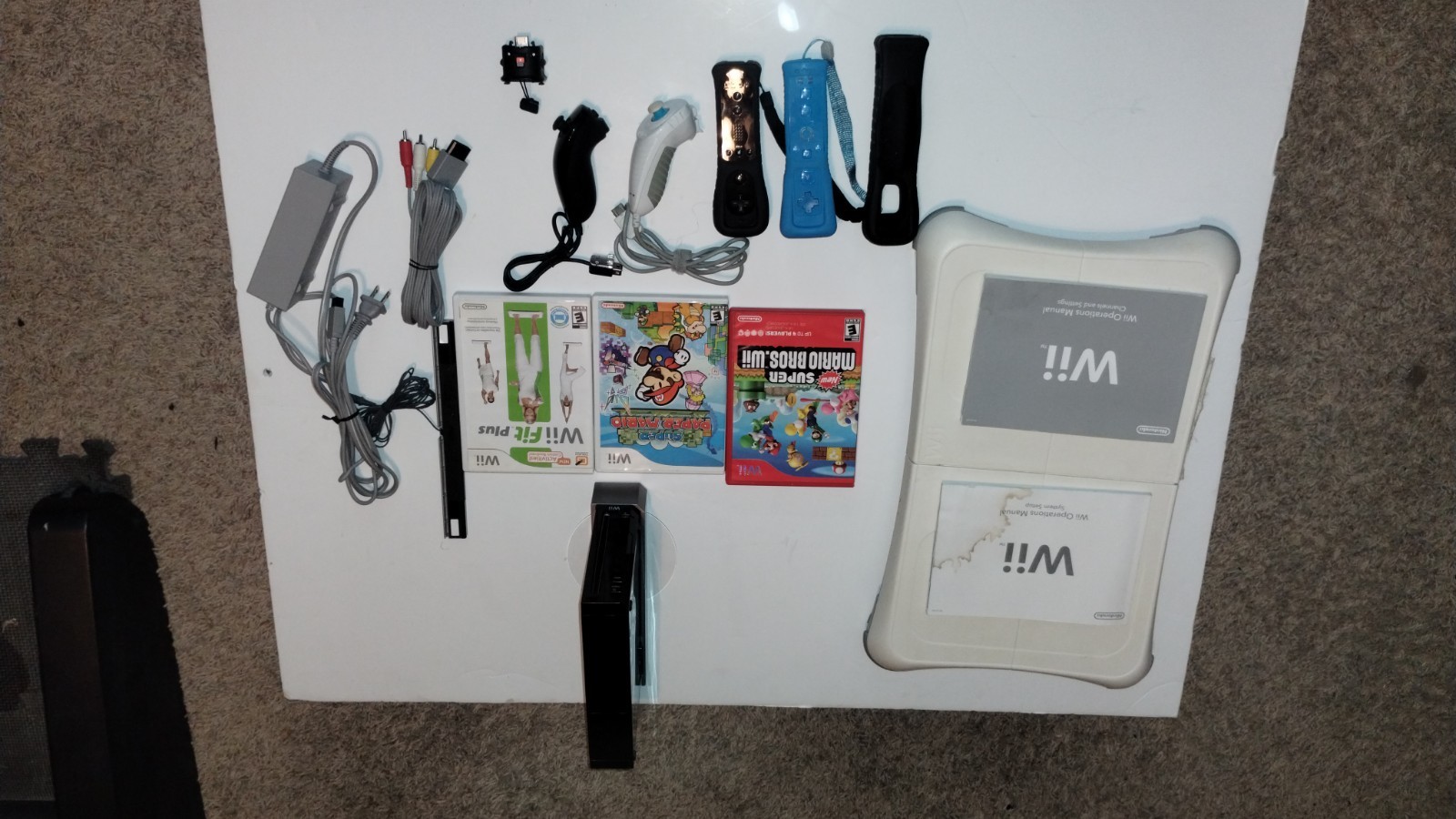 Nintendo Wii Console Bundle with Two Remotes & 3 Games And Wii Fit Board