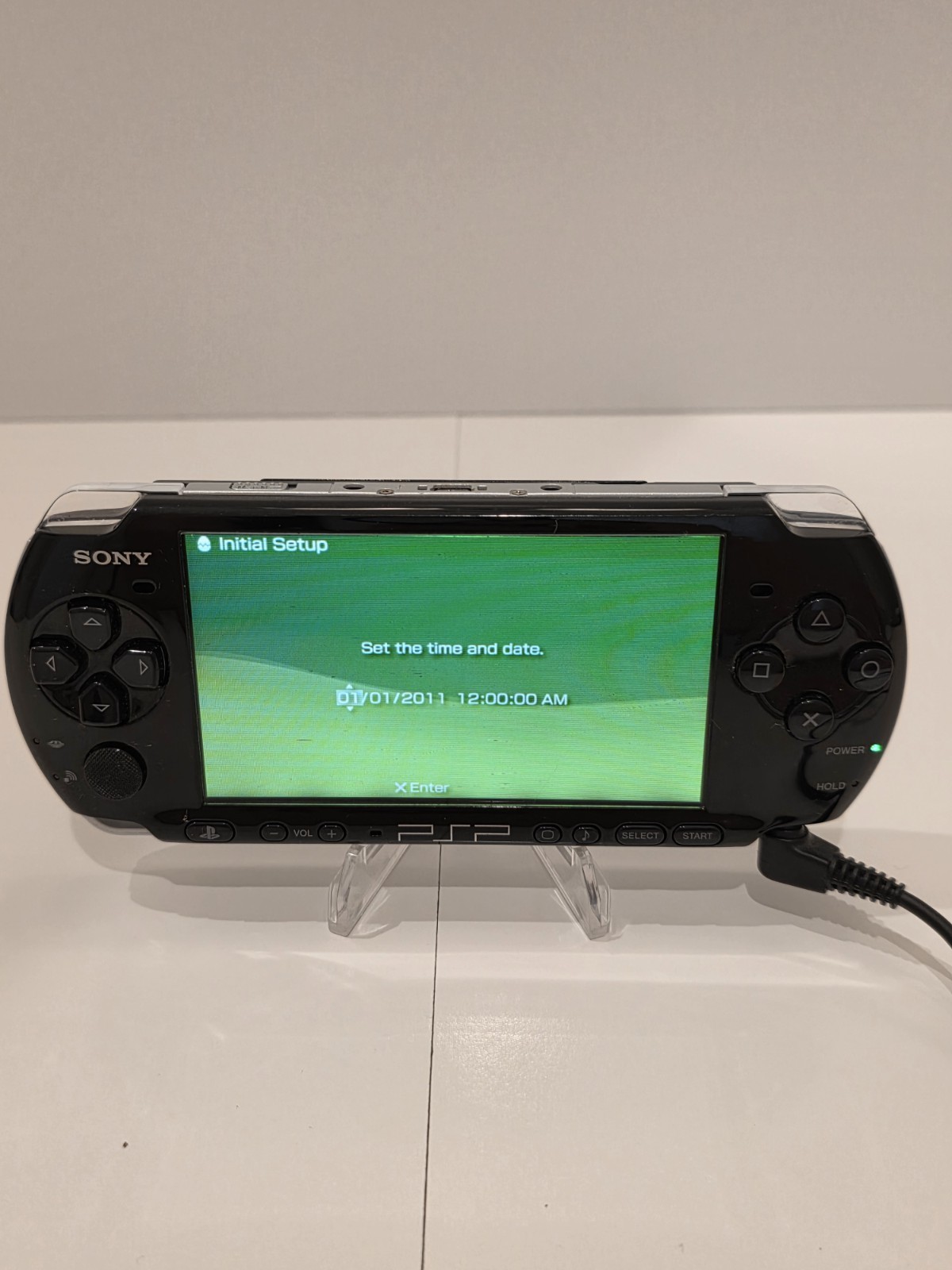 Sony PSP 3001 Black Handheld Console with Charger, Car Adapter, and 5 Games.
