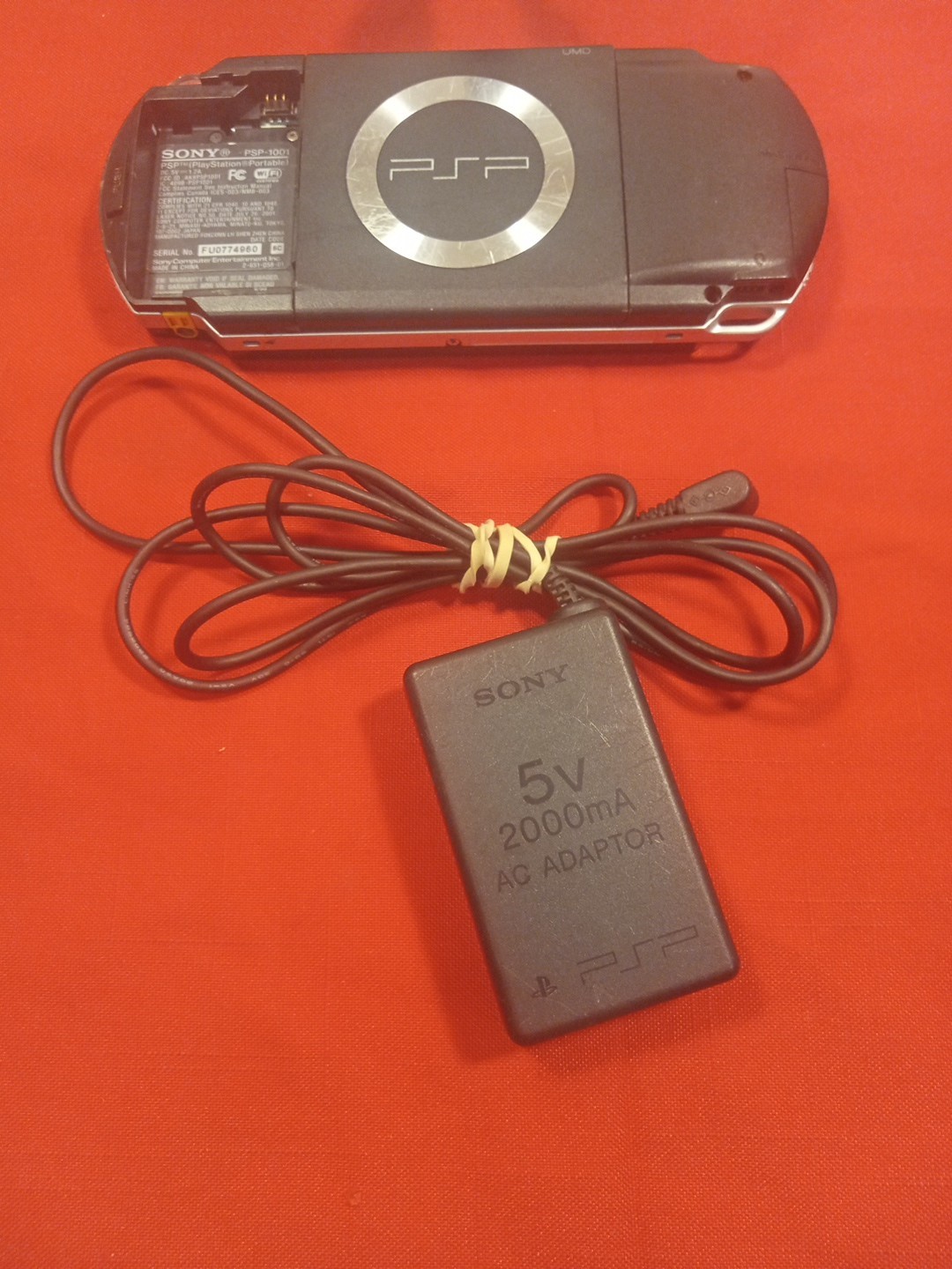 PSP 1001 CONSOLE+AC ADAPTER/NO TOGGLE BUTTON OR BATTERY & COVER/ SEE…