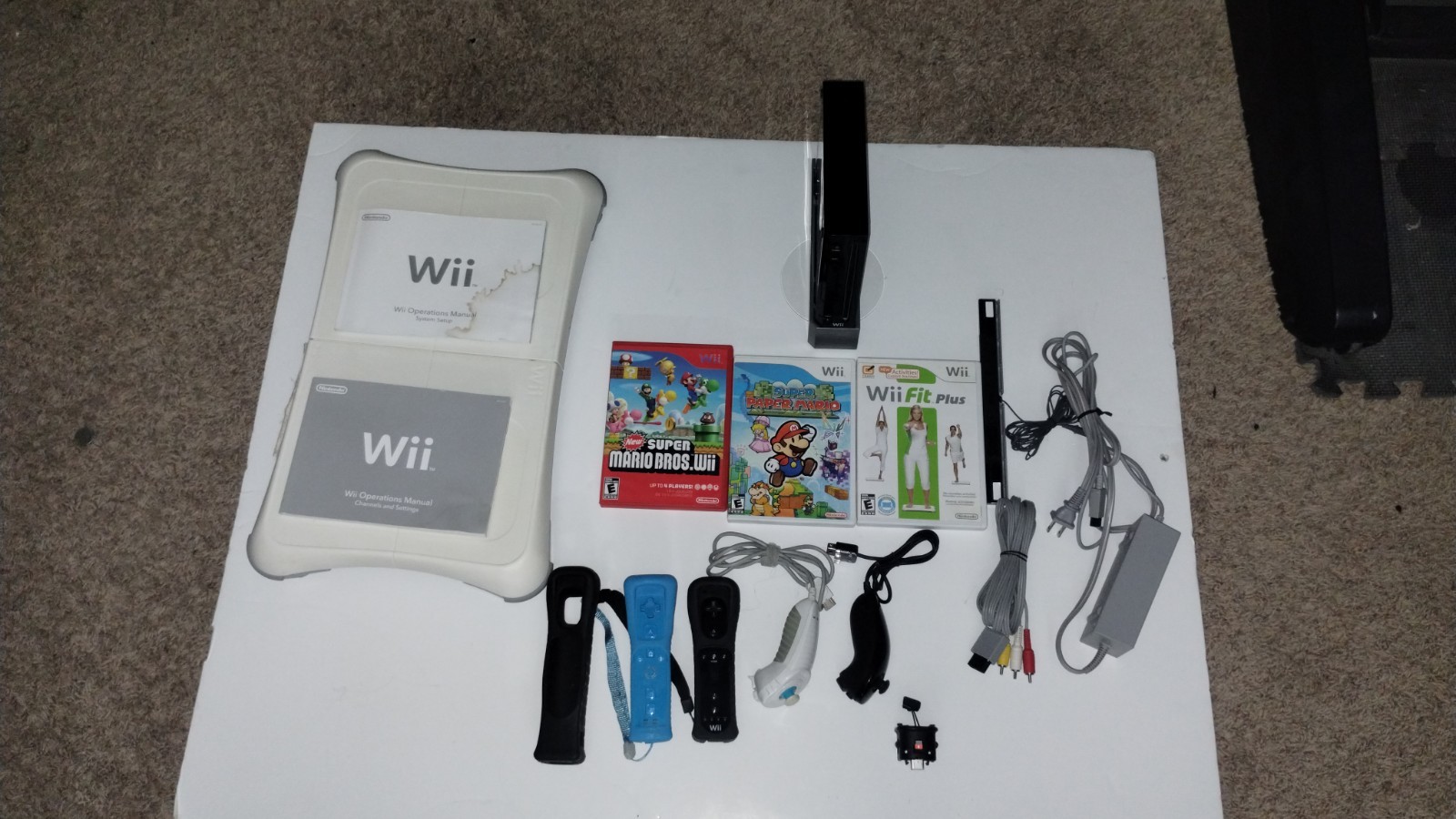 Nintendo Wii Console Bundle with Two Remotes & 3 Games And Wii Fit Board