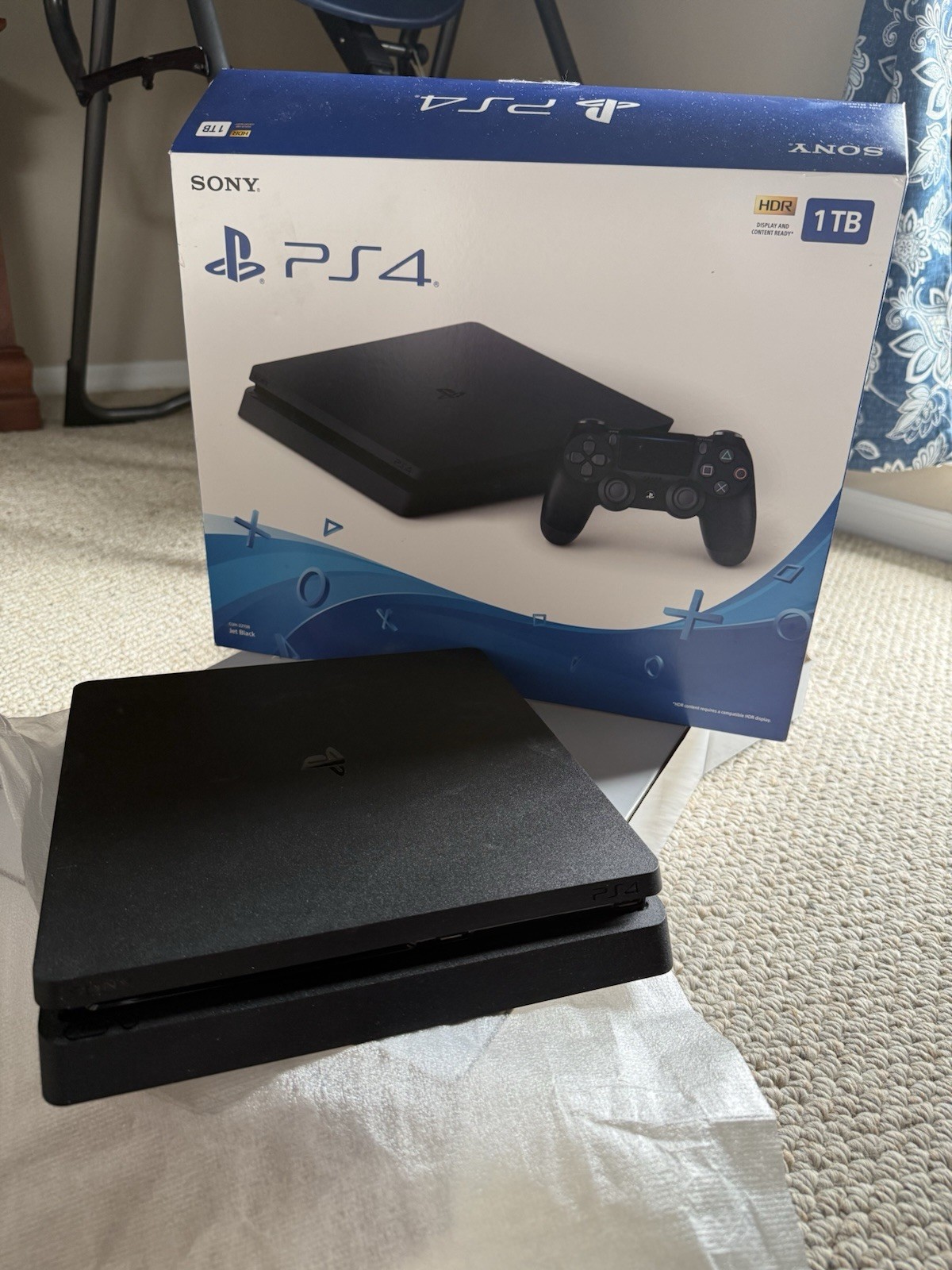 Sony PlayStation 4 Slim Jet Black, 500GB with 2 controllers (1 older model).