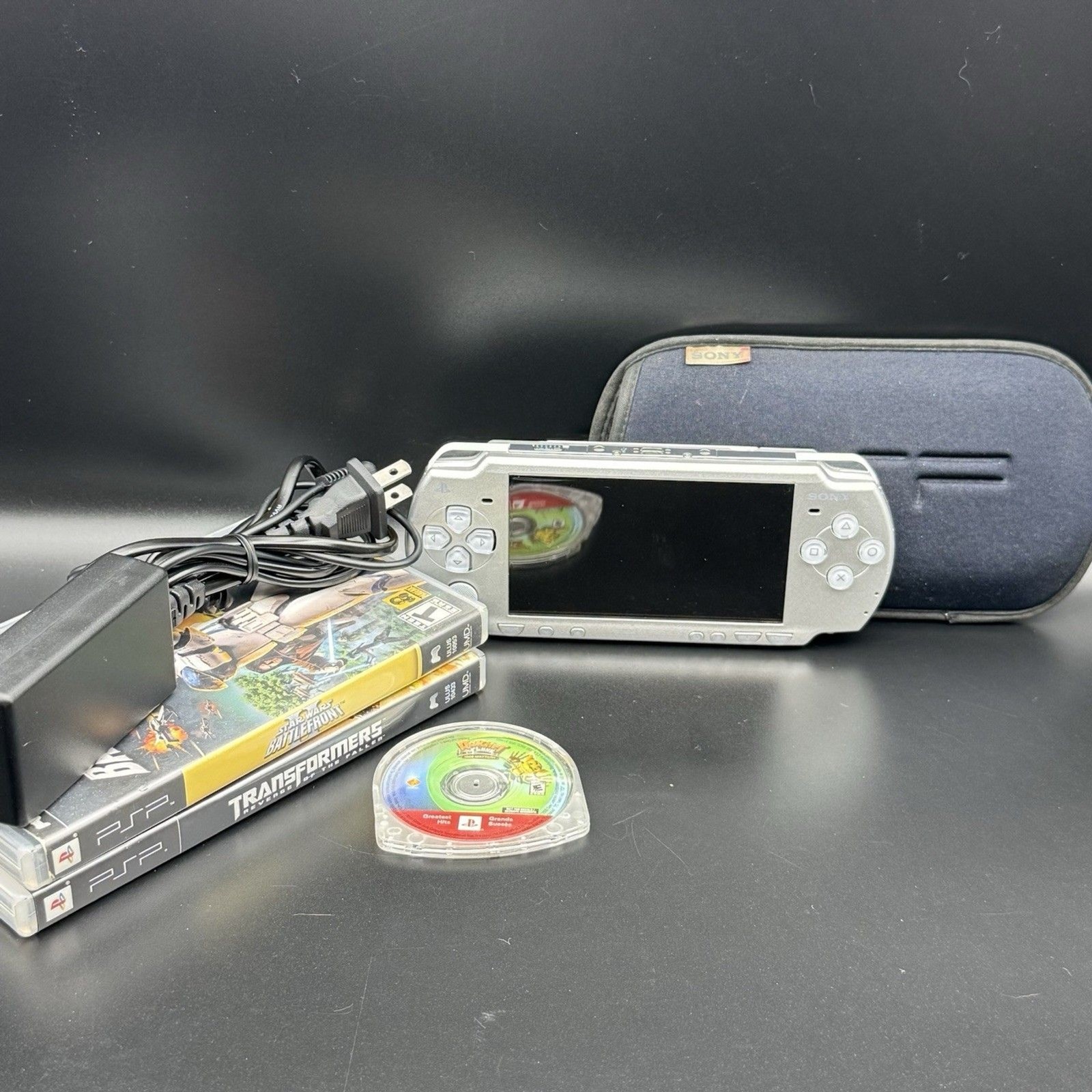 Sony PSP 2001 Handheld Console System Bundle + Charger + Traveling Case + Games